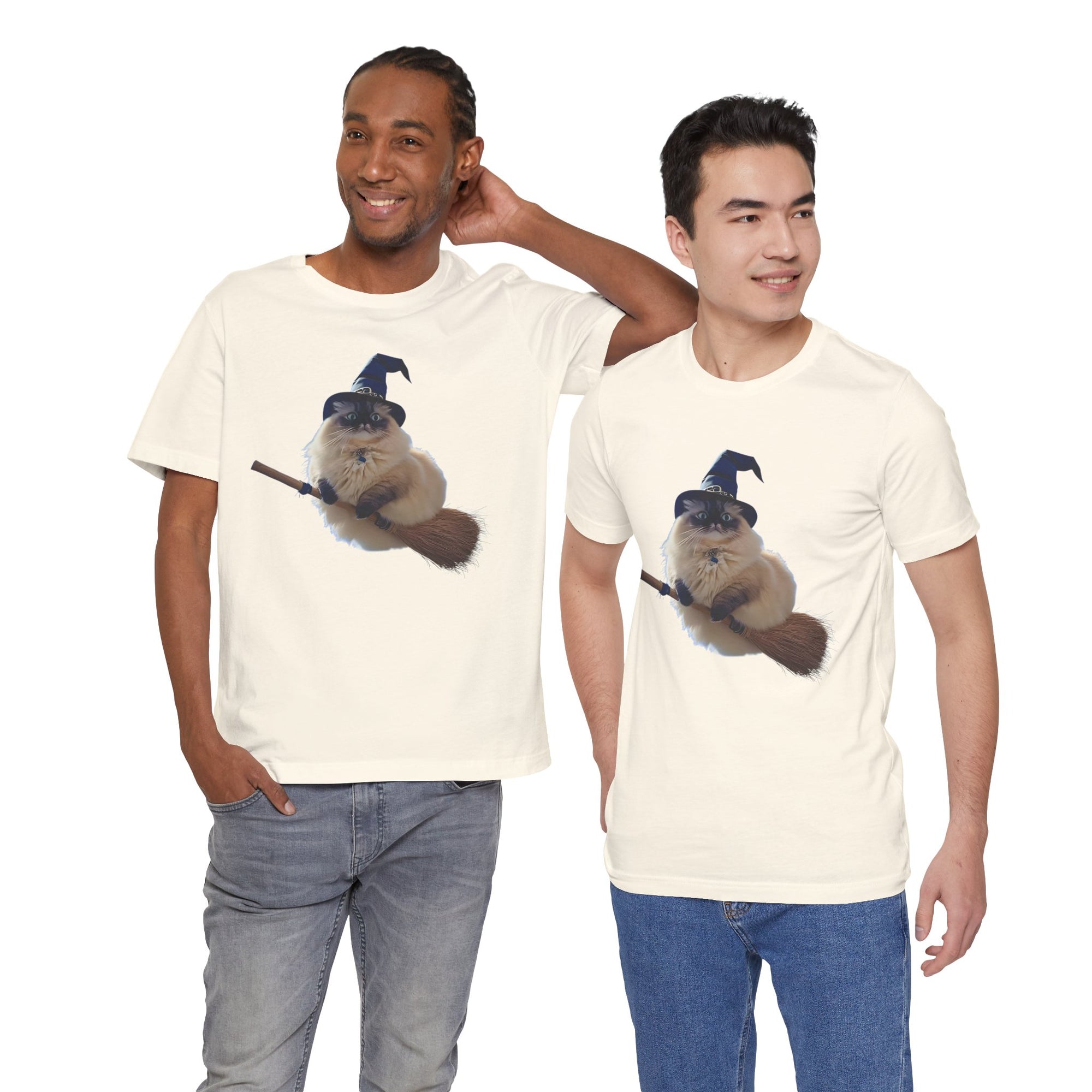 Two men wearing t-shirt featuring a fluffy cat wearing a blue witch hat and riding a broomstick.
