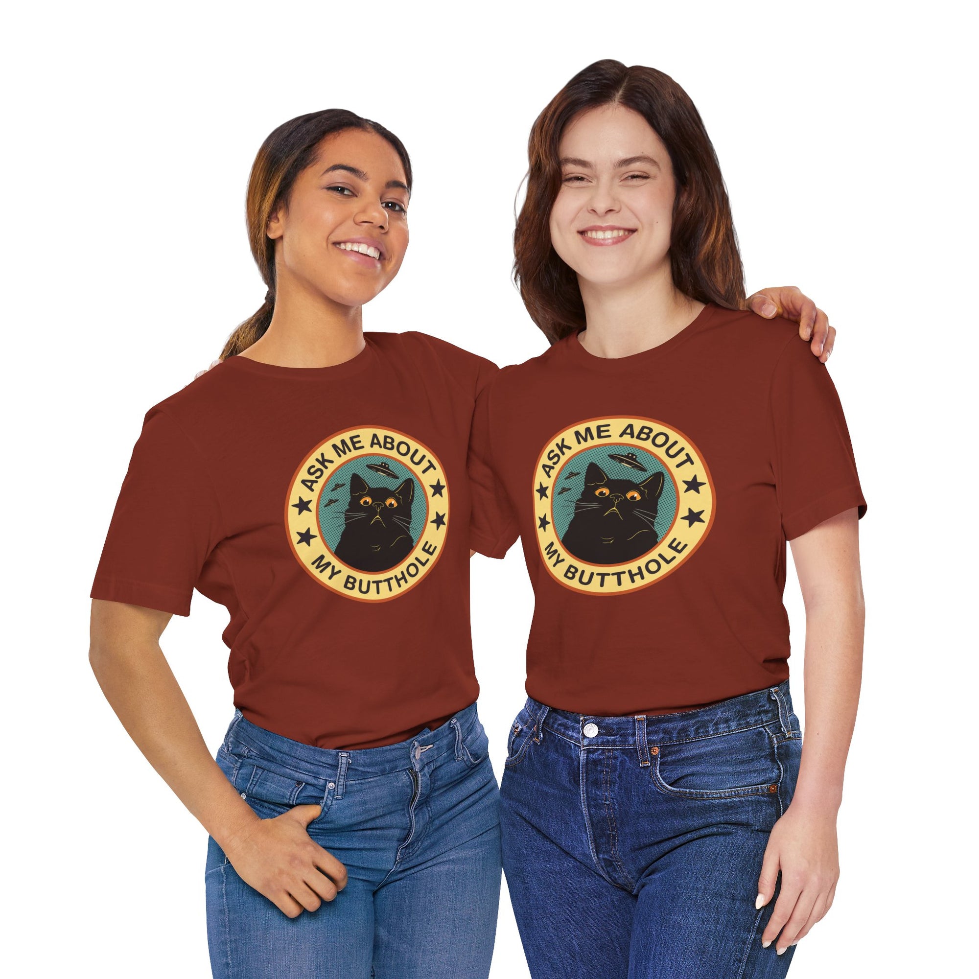 Two people wearing brown t-shirts with a black cat graphic and text on a white background