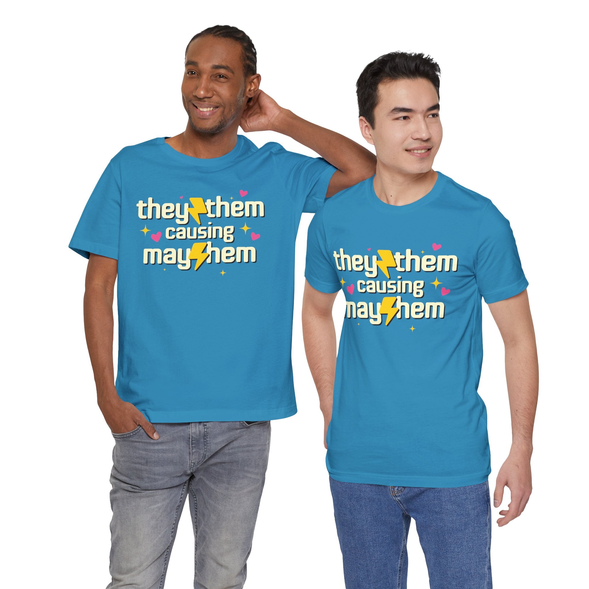 Two people wearing blue t-shirts with a colorful text design on a white background