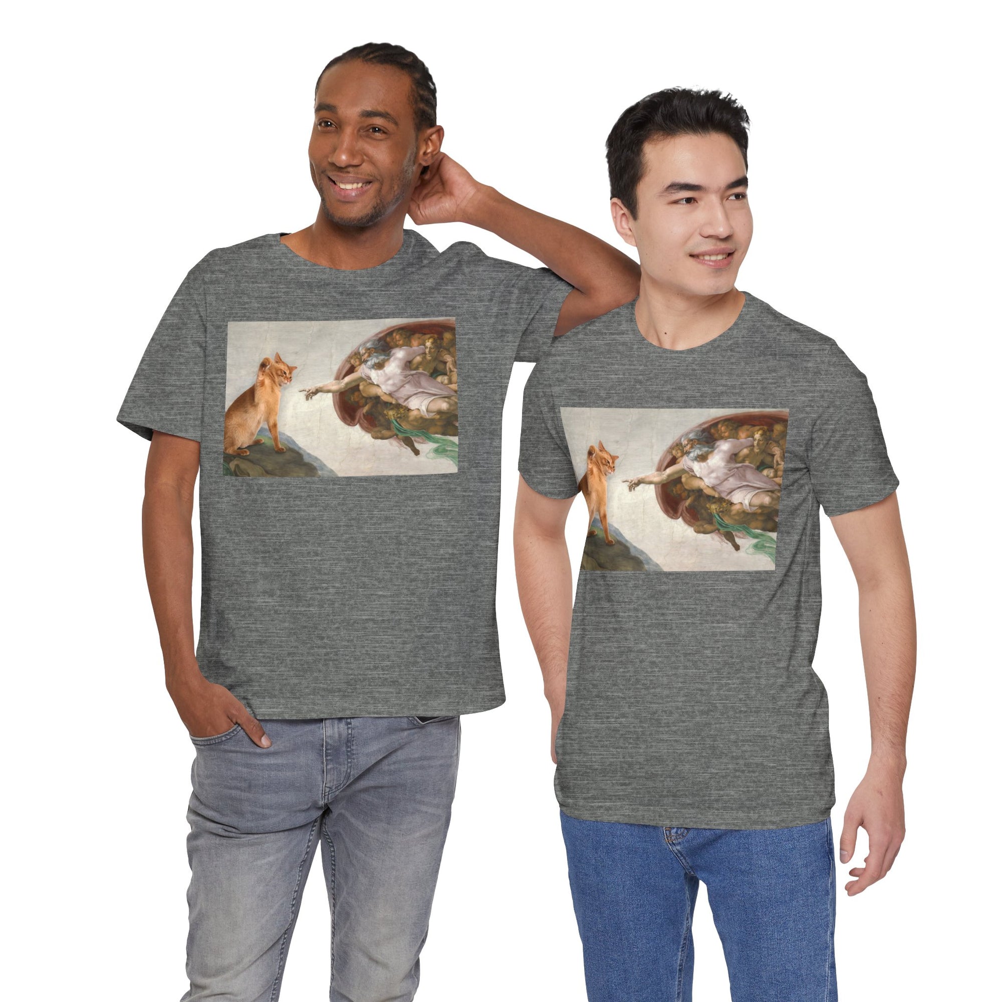 Two men wearing gray t-shirts with a graphic design of a cat and god on a white background.