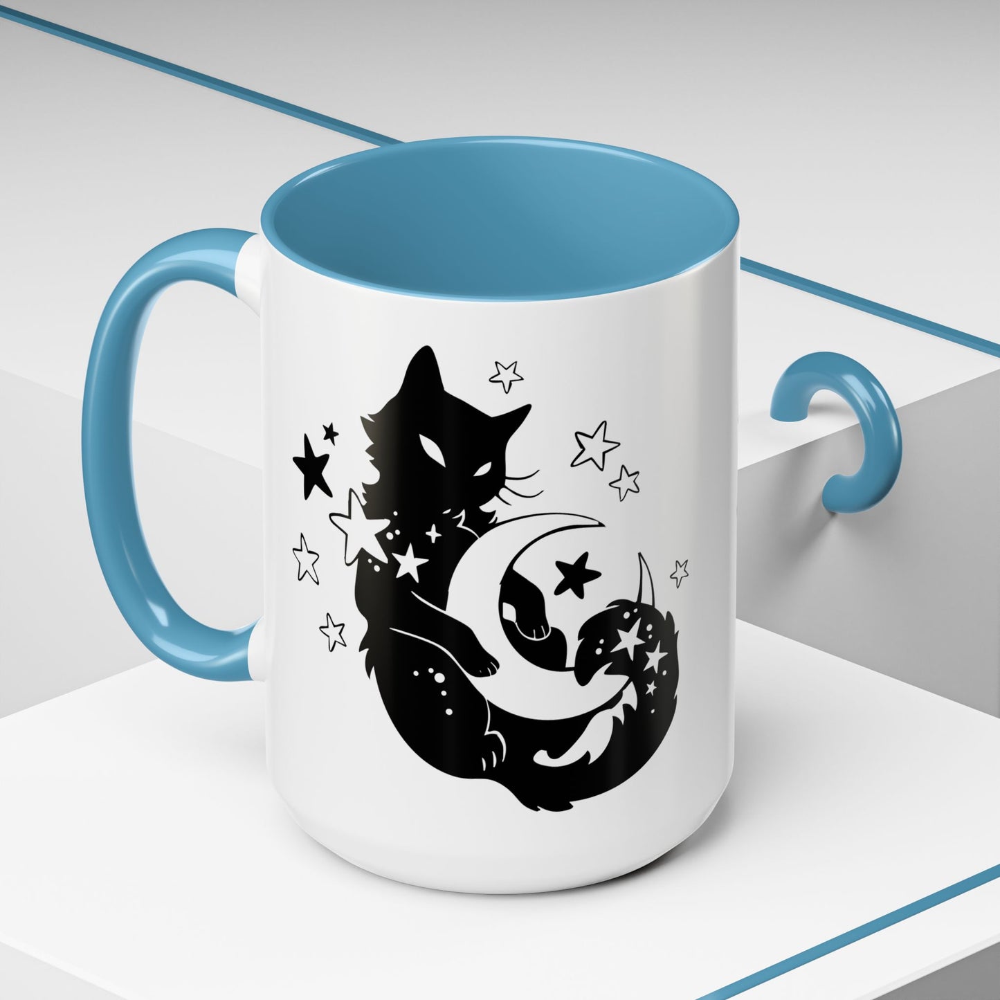 White mug with blue interior and handle, featuring a black cat and moon design.