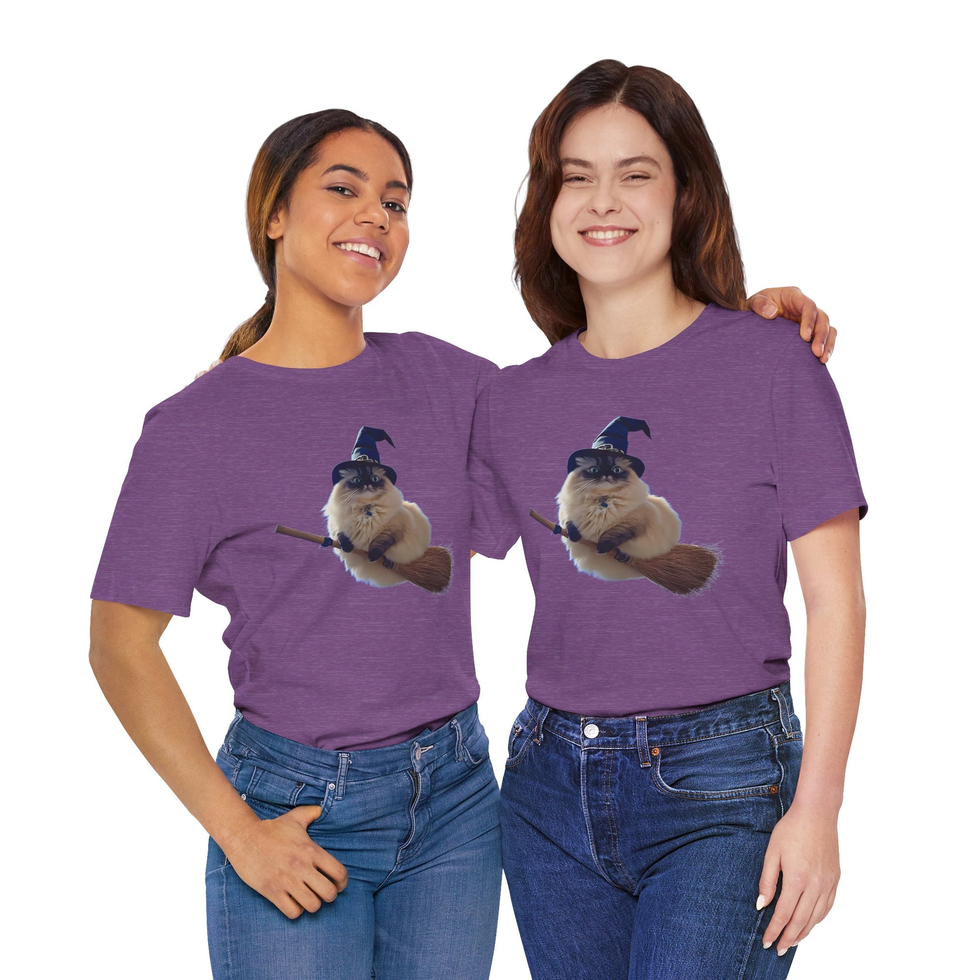 Two people wearing purple t-shirts with a cat in a witch hat and broom graphic.