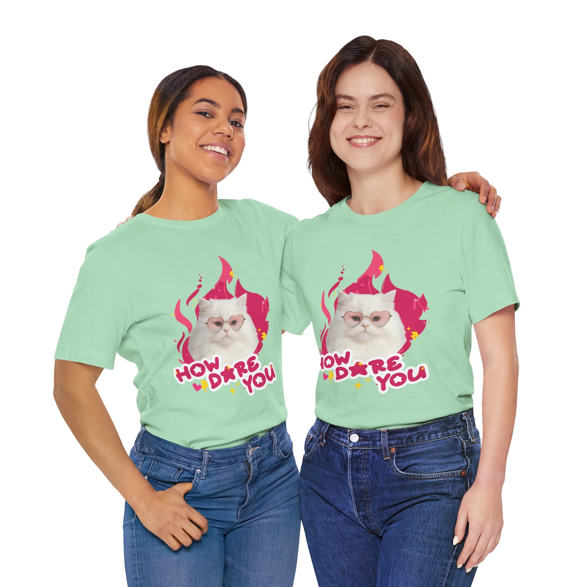 Two people wearing light green t-shirts with a cartoon cat design and text.