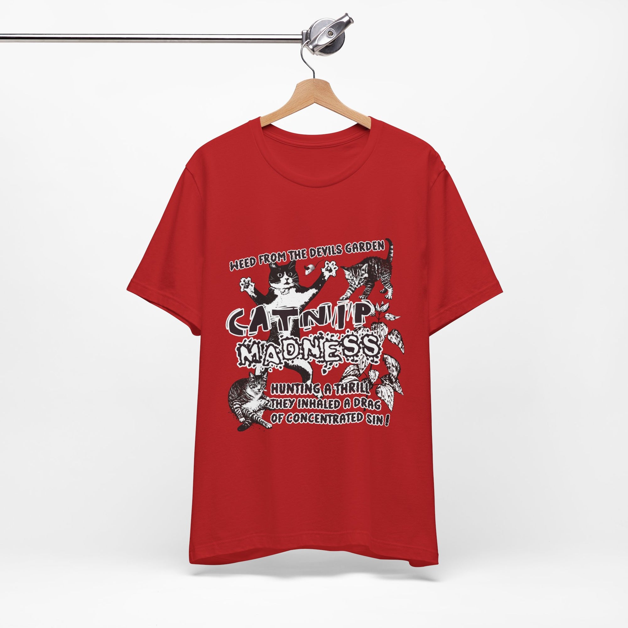 Red t-shirt with graphic design on a hanger against a white background