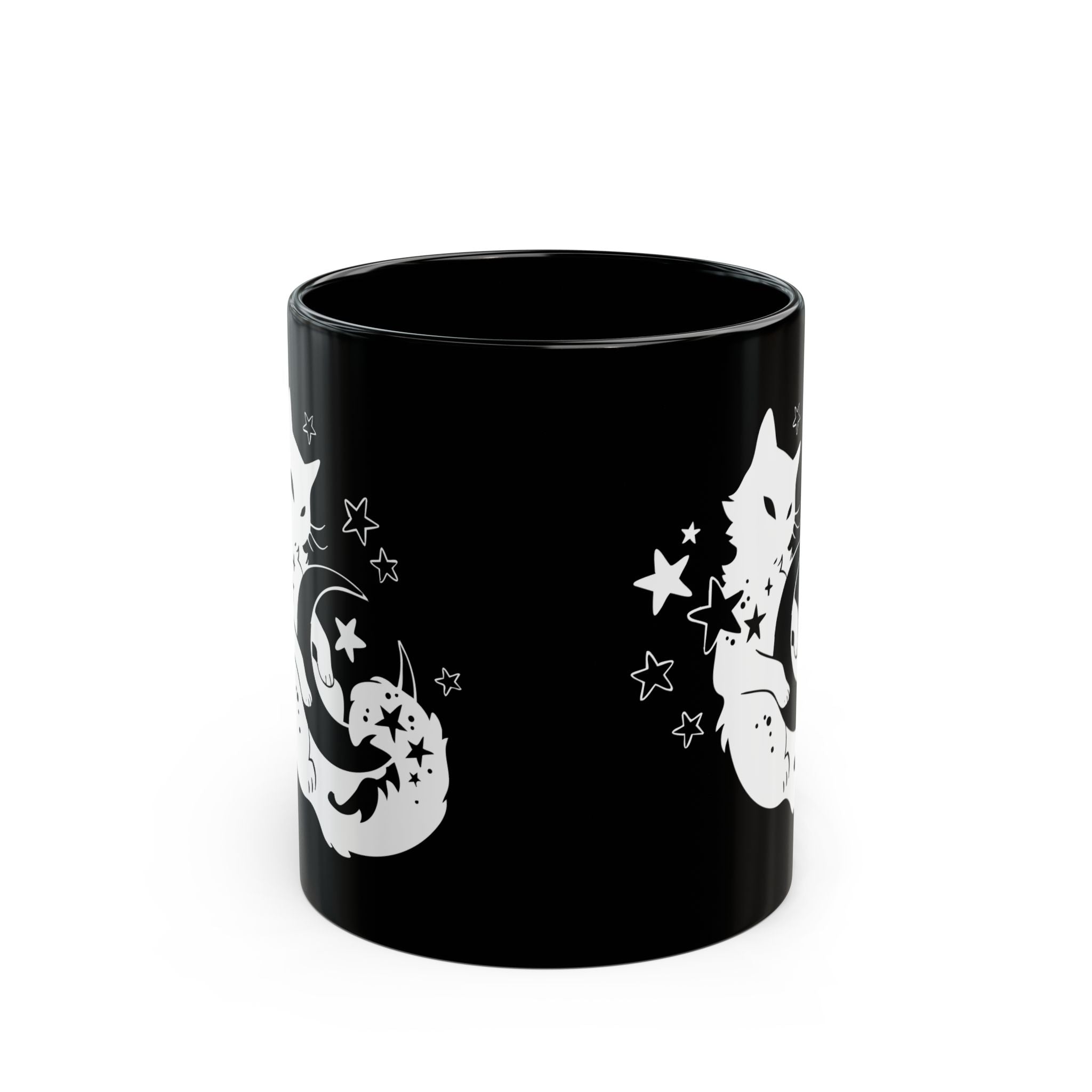 Black mug with white cat and star designs on a white background