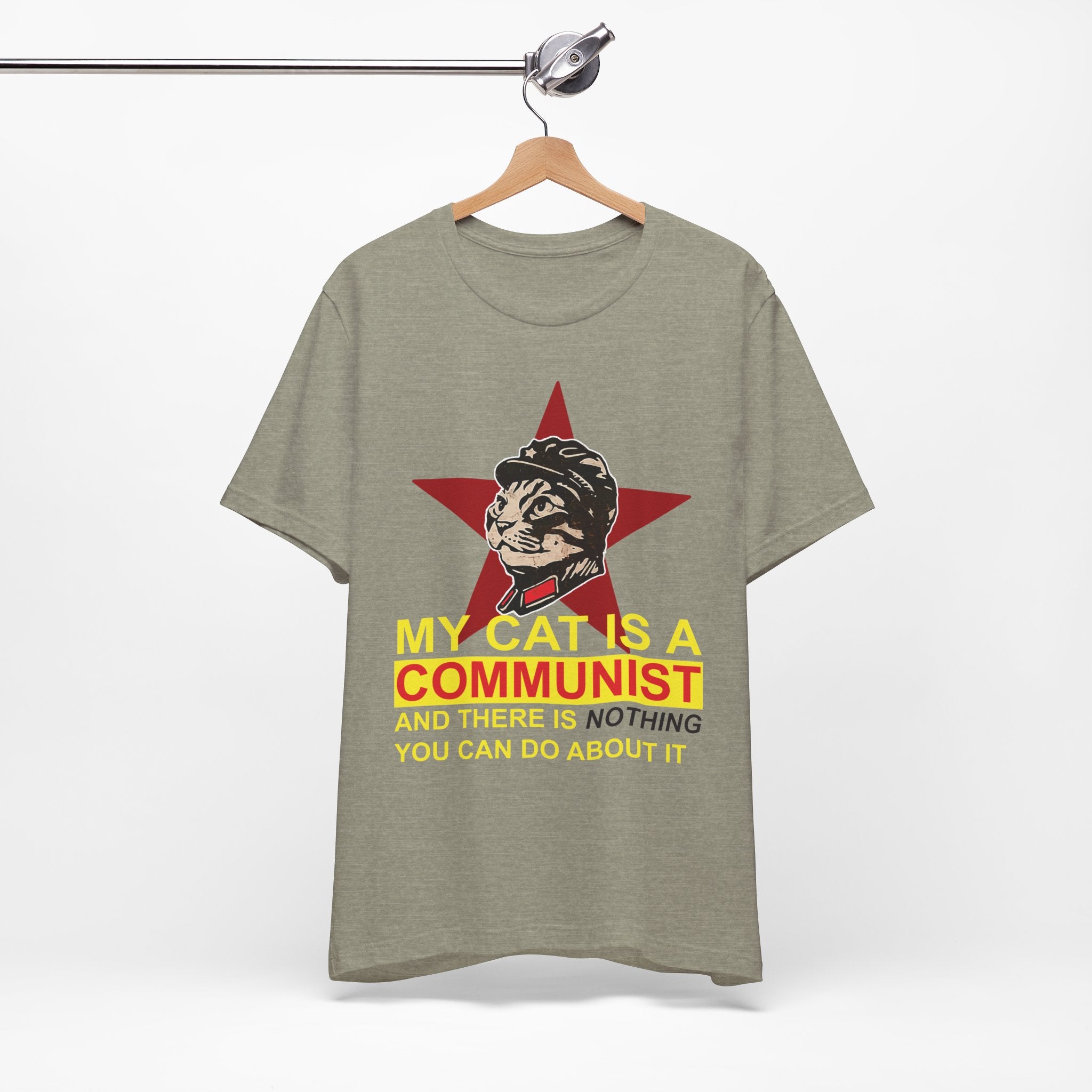 Gray t-shirt with a graphic of a cat in a military uniform and text on a hanger against a white background