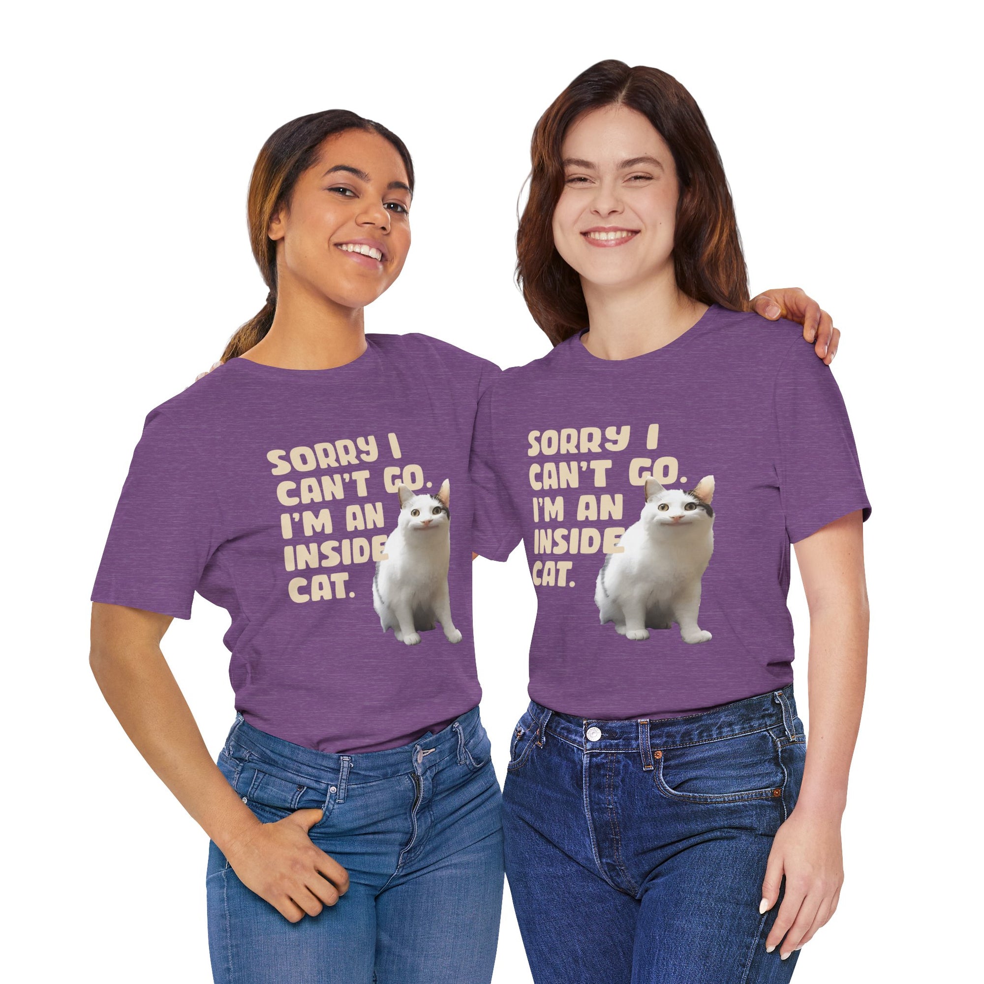 Two people wearing purple t-shirts with a graphic of a cat and text on a white background