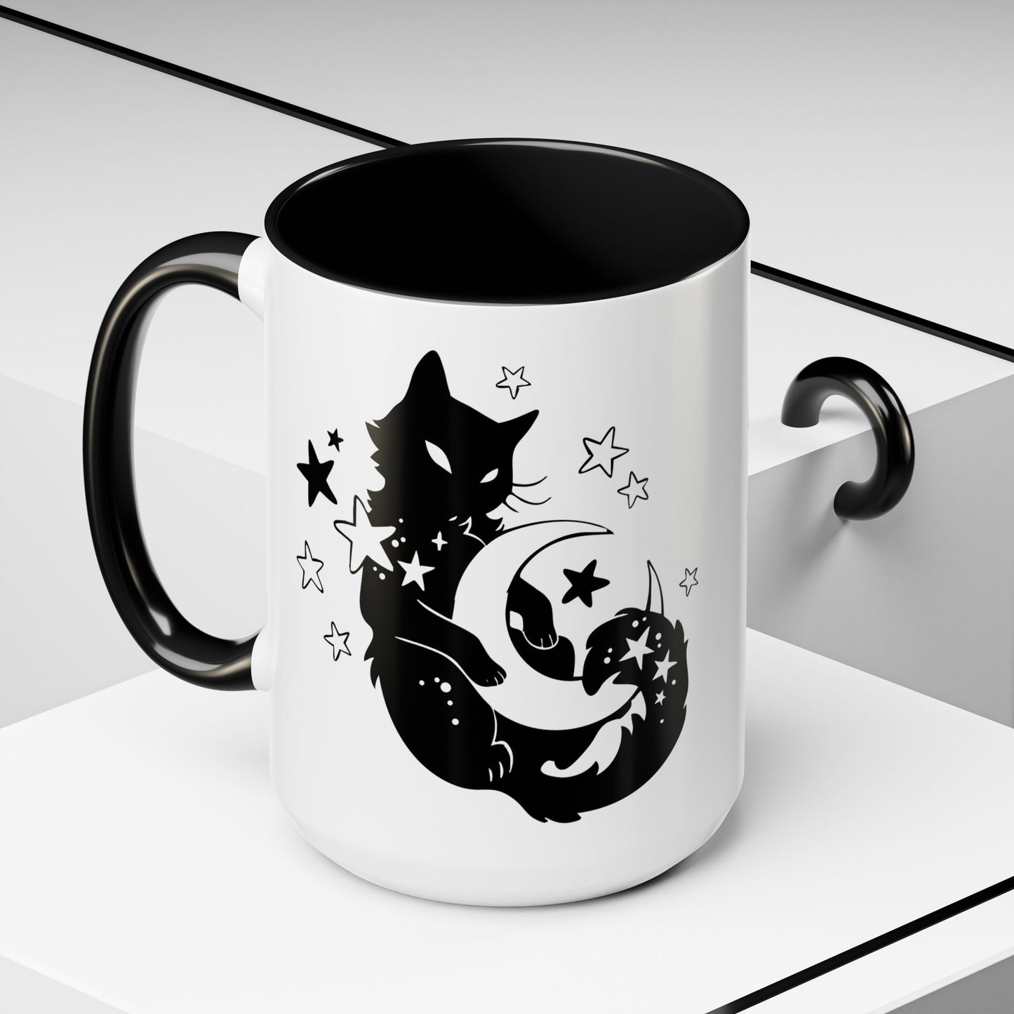 White mug with black interior and handle, featuring a black cat and moon design on a white background.