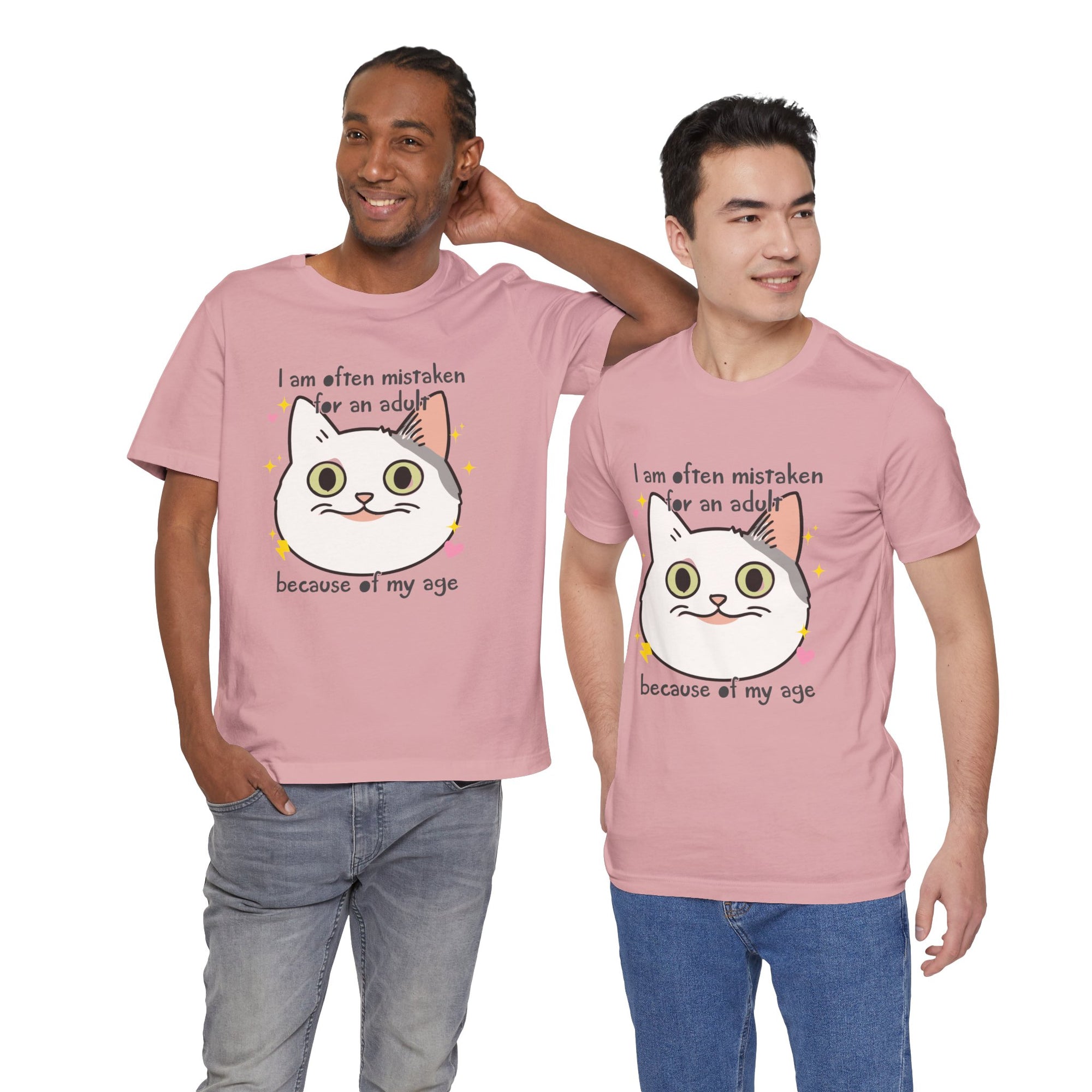 Two men wearing pink t-shirts with a cartoon cat graphic and text.