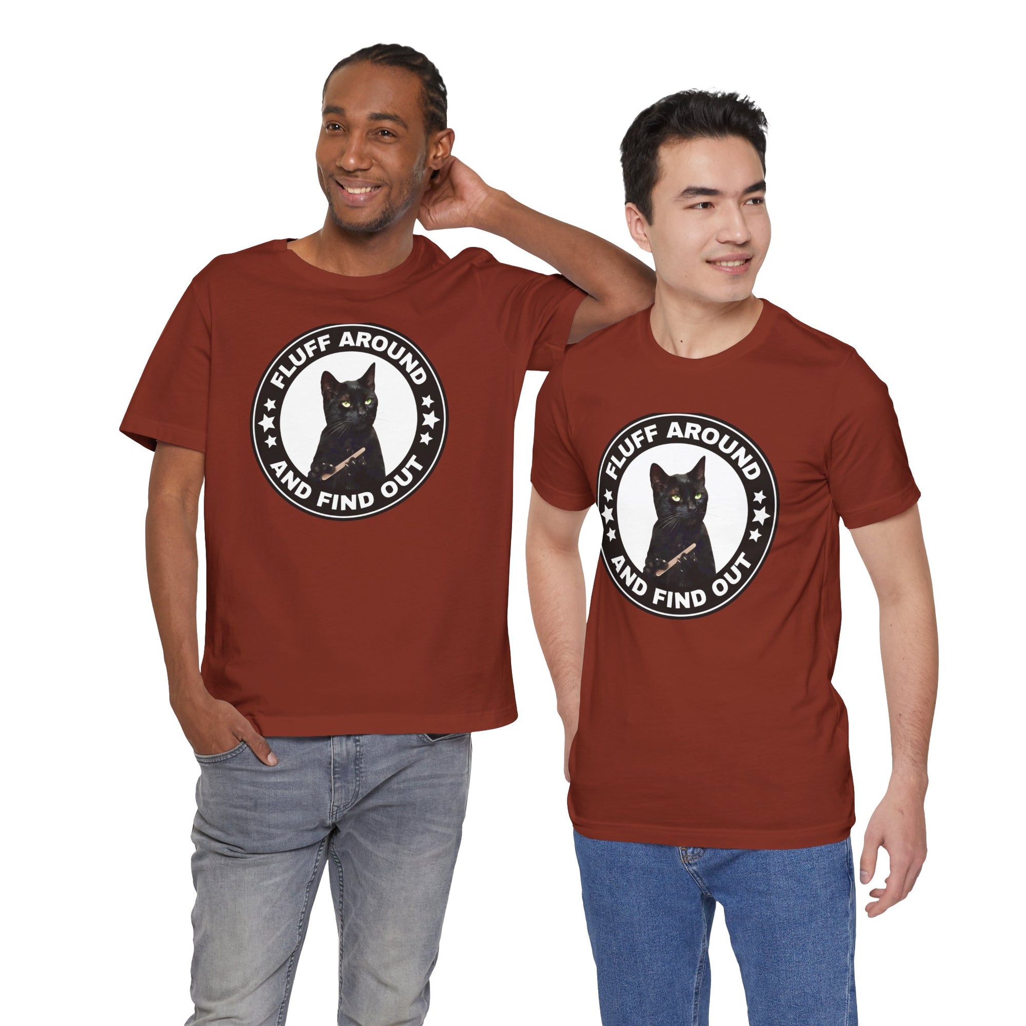 Two men wearing brown t-shirt featuring a circular badge design with a black cat and the phrase “Fluff Around and Find Out.”