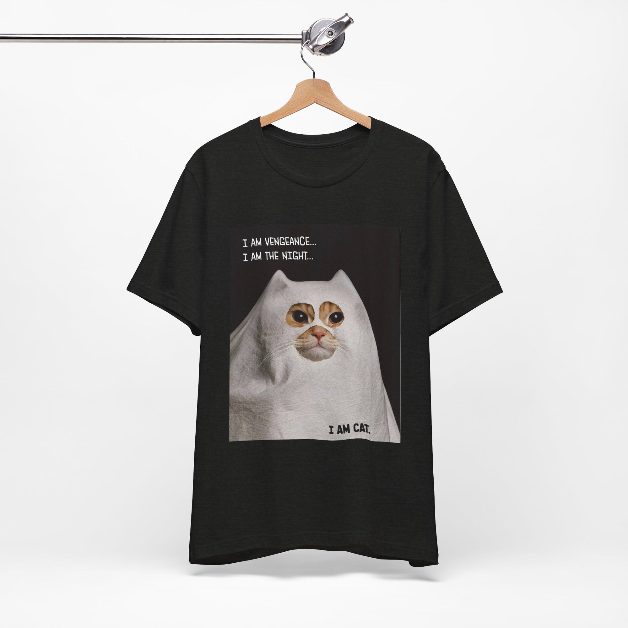 Black t-shirt with a cat graphic and text on a hanger against a white background
