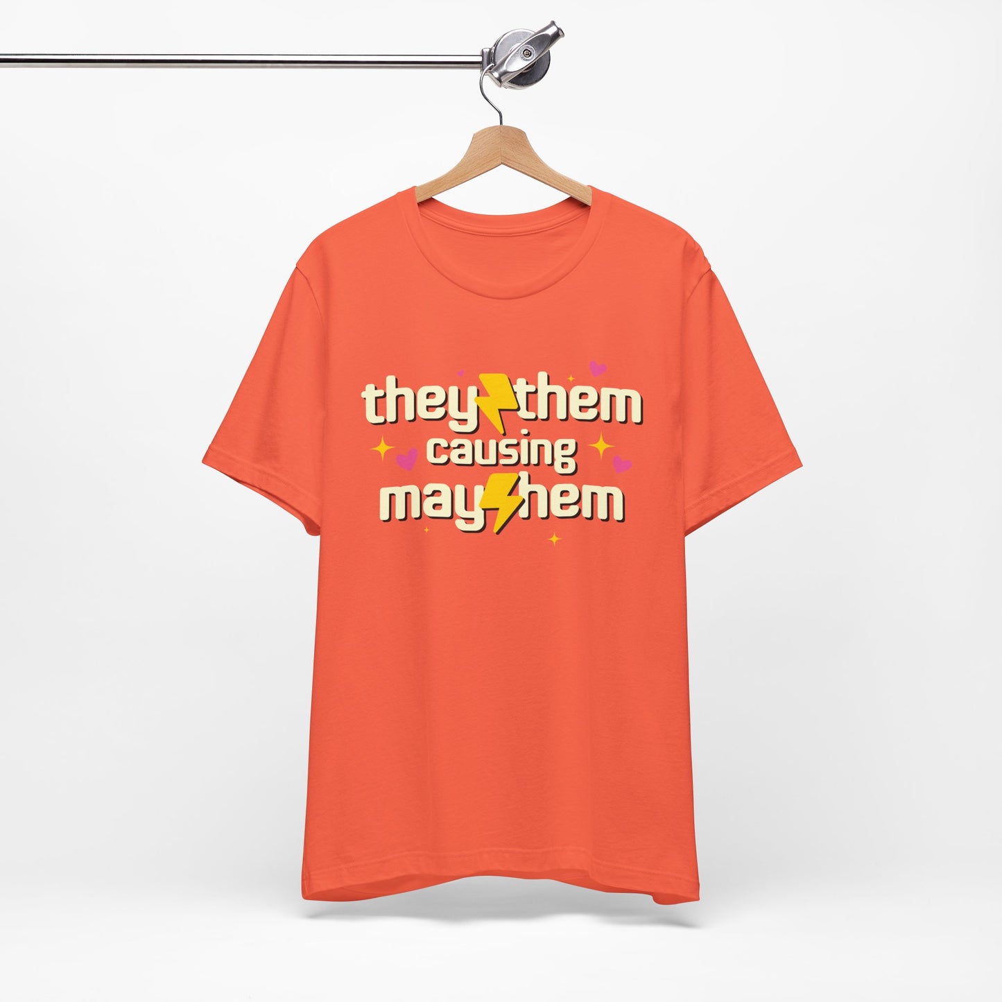 Orange t-shirt with text and symbols on a hanger against a white background
