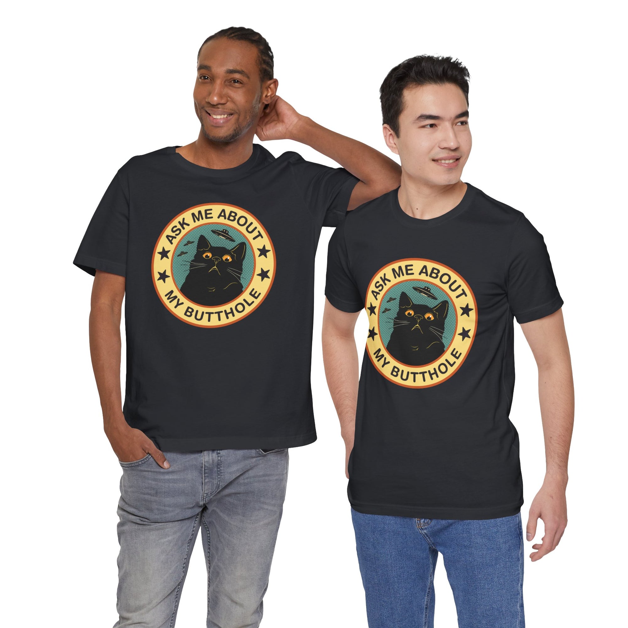 Black t-shirt featuring a retro-style circular black cat badge with stars, bats, and the phrase “Ask Me About My Butthole.”

