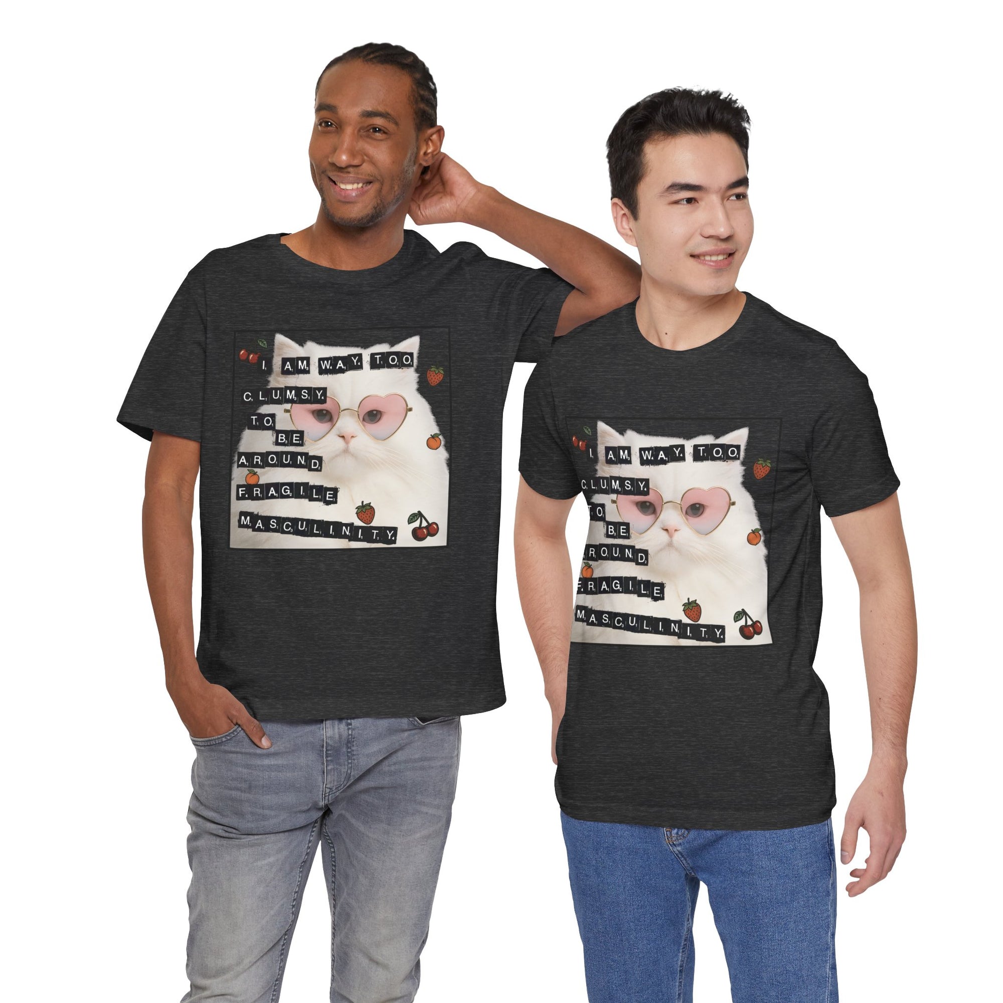 Two men wearing black t-shirt featuring a fluffy white cat in pink heart-shaped sunglasses with ransom-note style text that says “I am way too clumsy to be around fragile masculinity.”