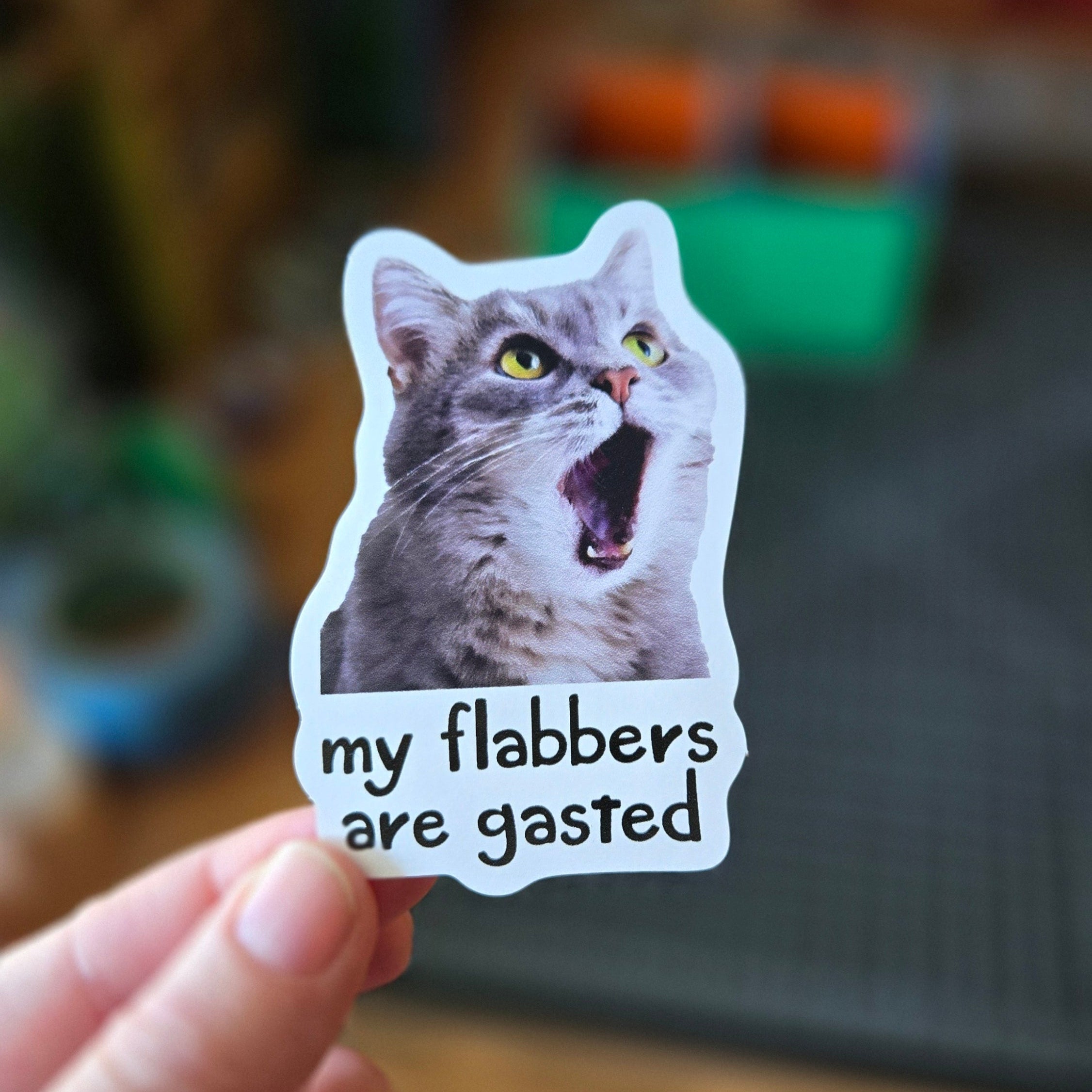 Die cut sticker featuring a shocked gray cat with its mouth open and the phrase “my flabbers are gasted.”
