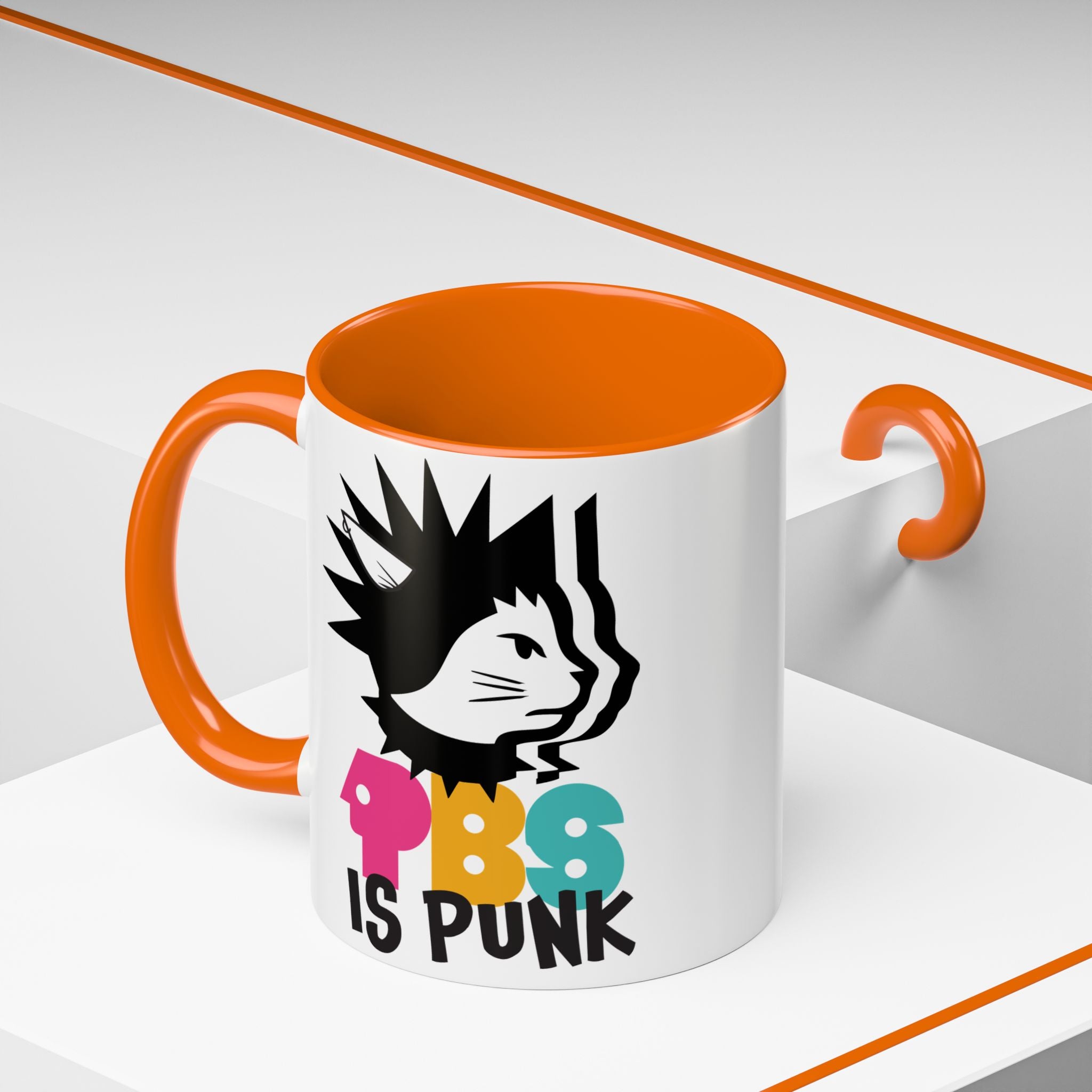 Mug with orange interior and handle, featuring a graphic of a cat and text 'PBS IS PUNK' on a white background.