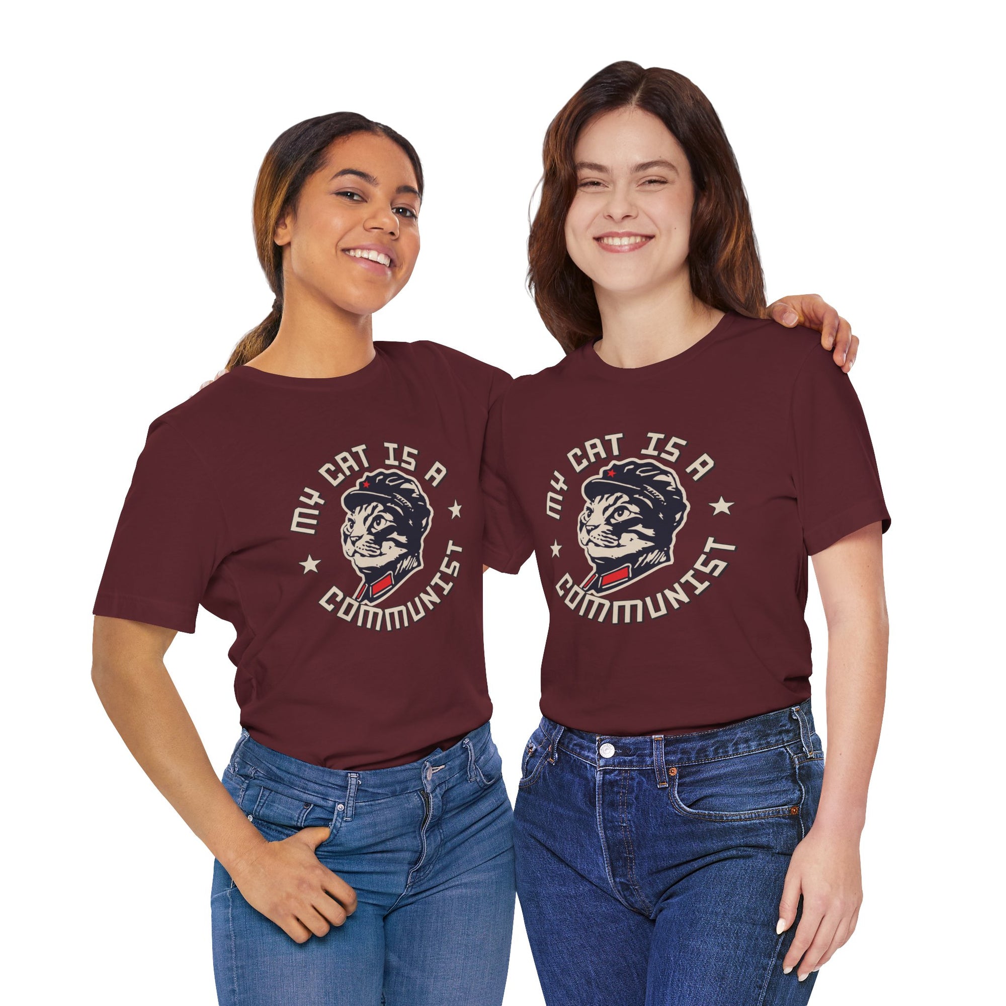 Two women wearing maroon t-shirts with a graphic design of a Jeep Rubicon on a white background.
