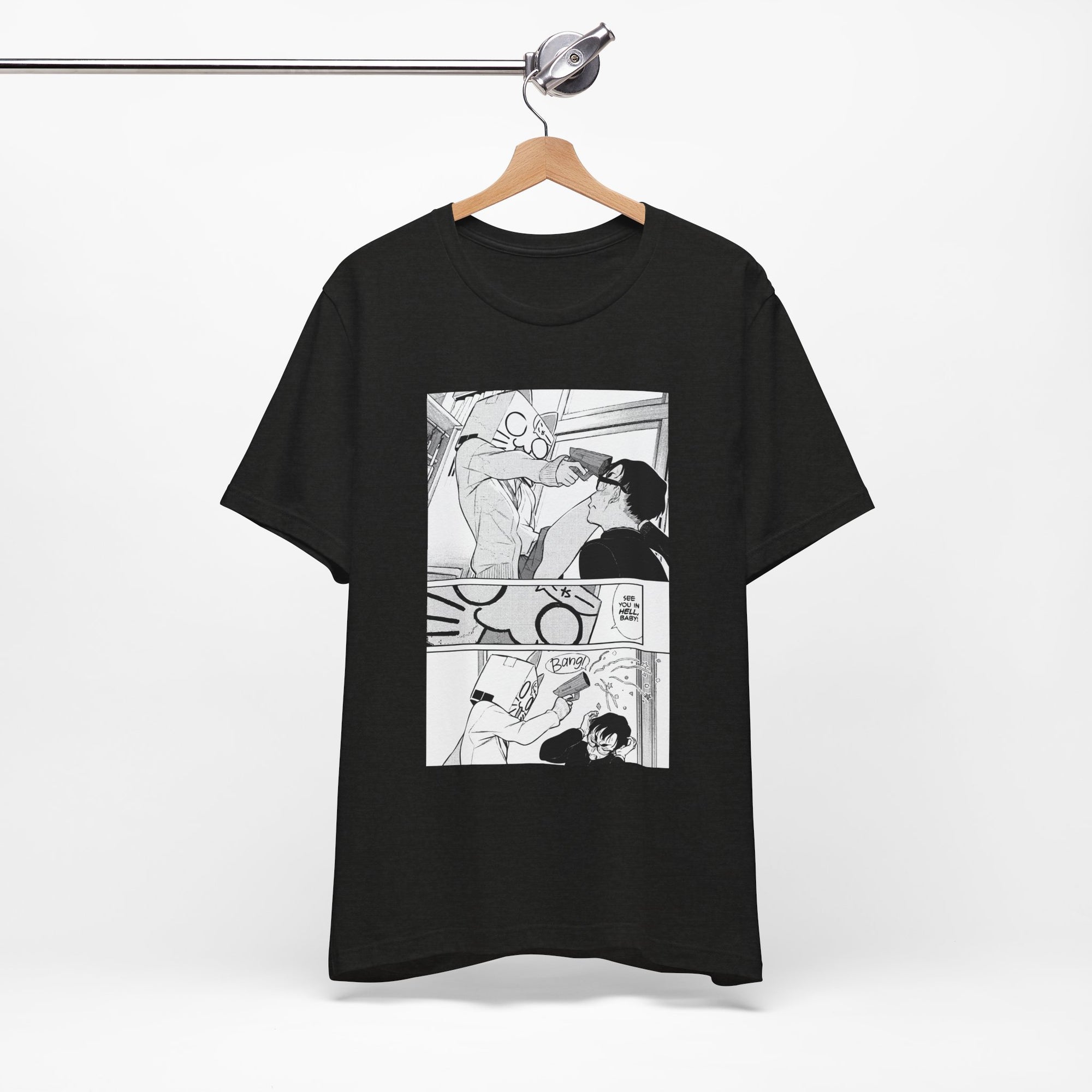 Black t-shirt with comic-style graphic on a hanger against a white background