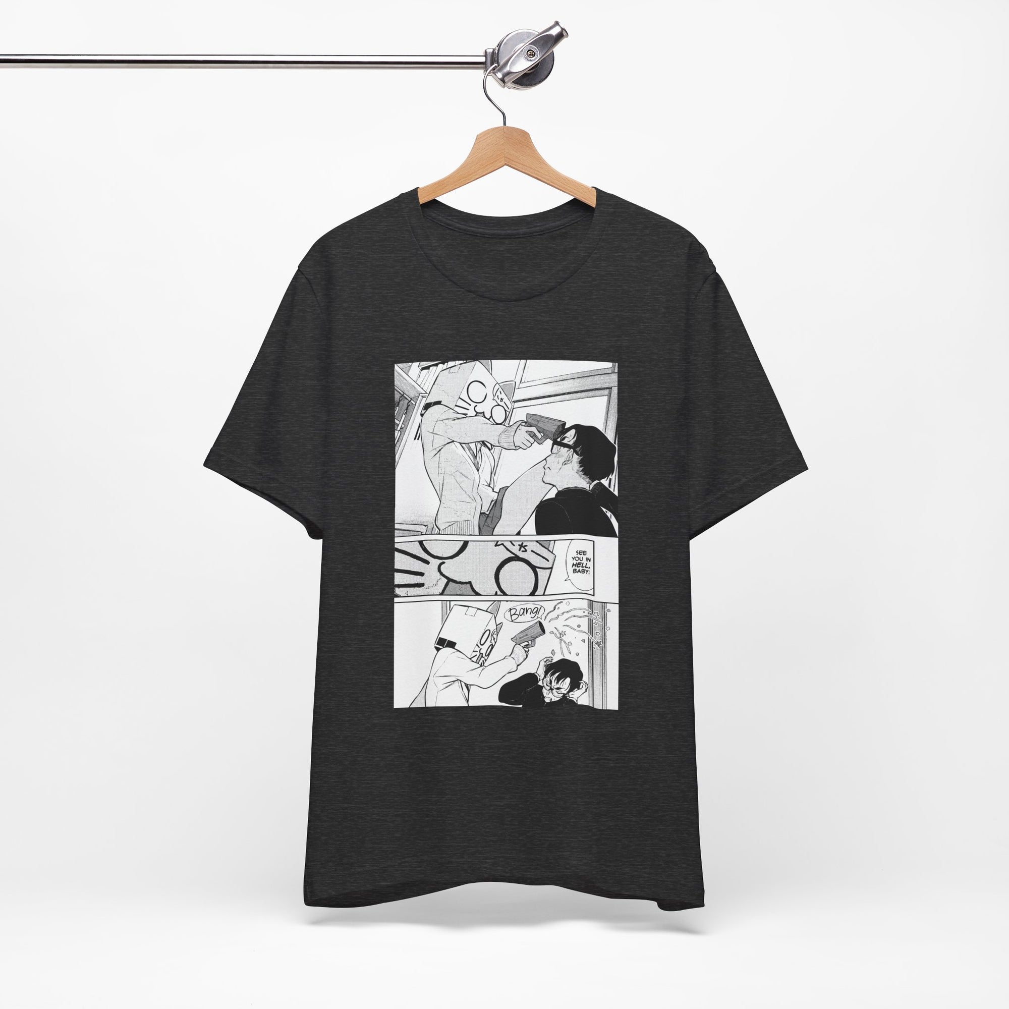 Black t-shirt with comic-style graphic on a hanger against a white background