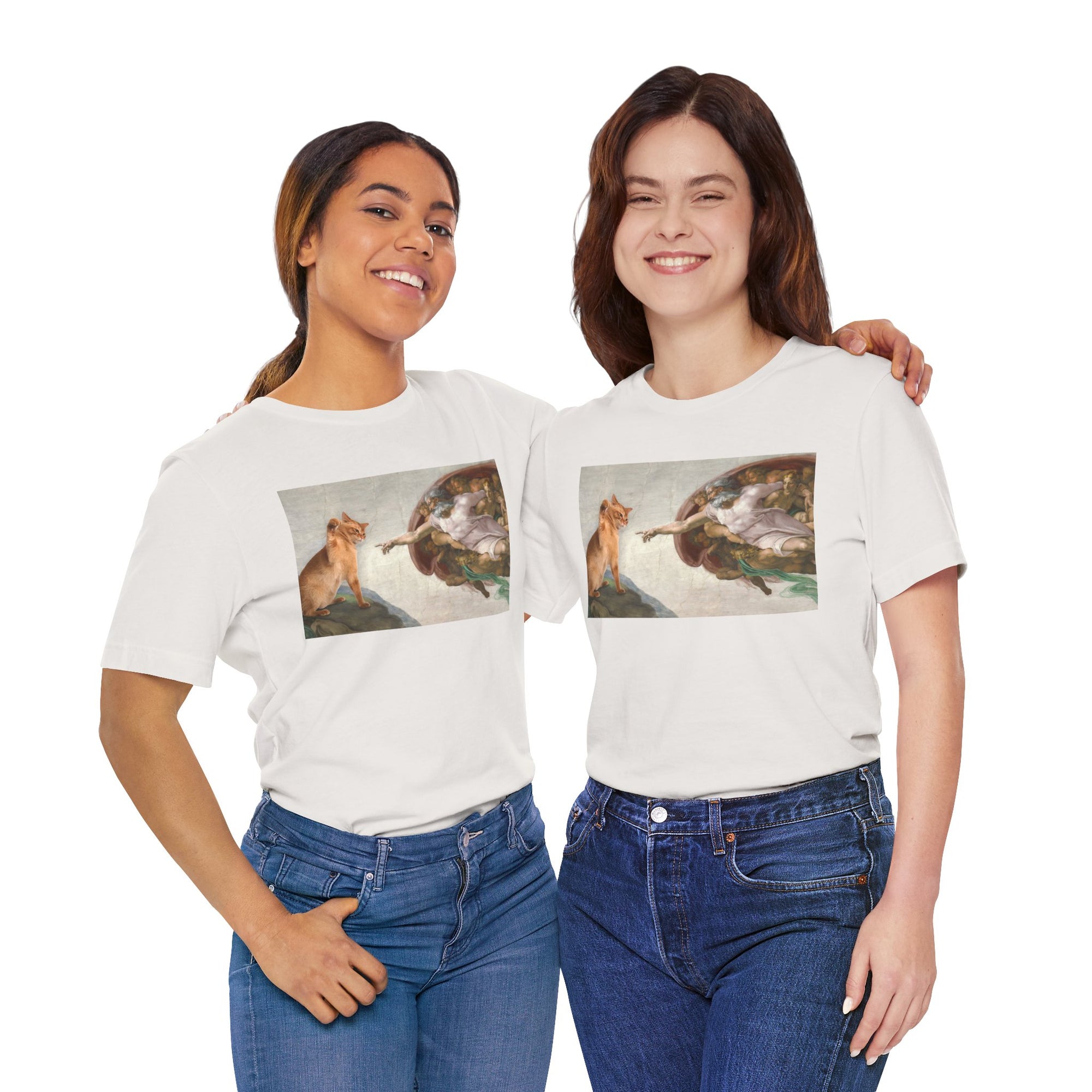 Two women wearing white t-shirts with a cat and god on a white background