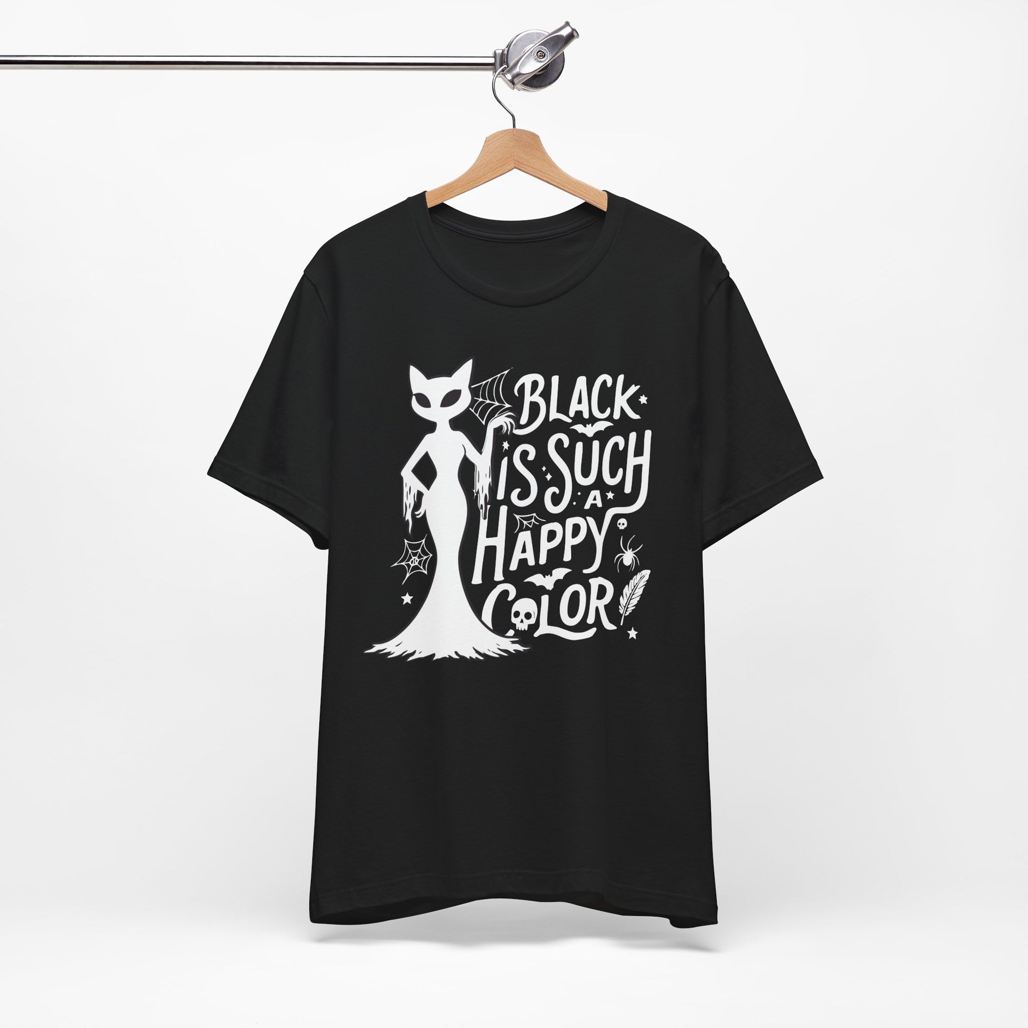 Black t-shirt featuring a white spooky cat graphic with the phrase “Black Is Such a Happy Color,” plus bats, spiderwebs, stars, and Halloween details.

