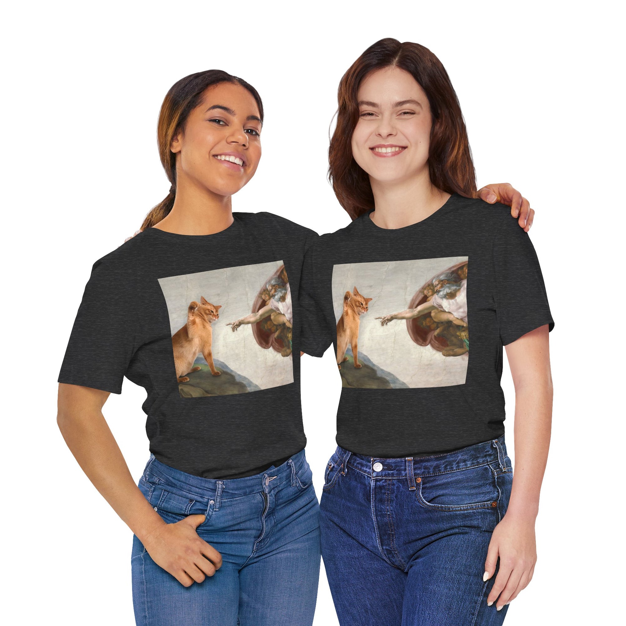Two people wearing black t-shirts with artistic prints of a woman and a dog.