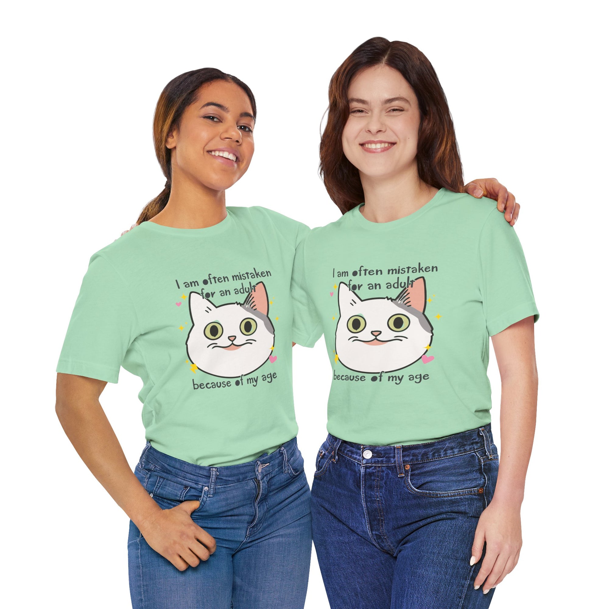 Two people wearing matching light green t-shirts with a cartoon cat graphic and text.