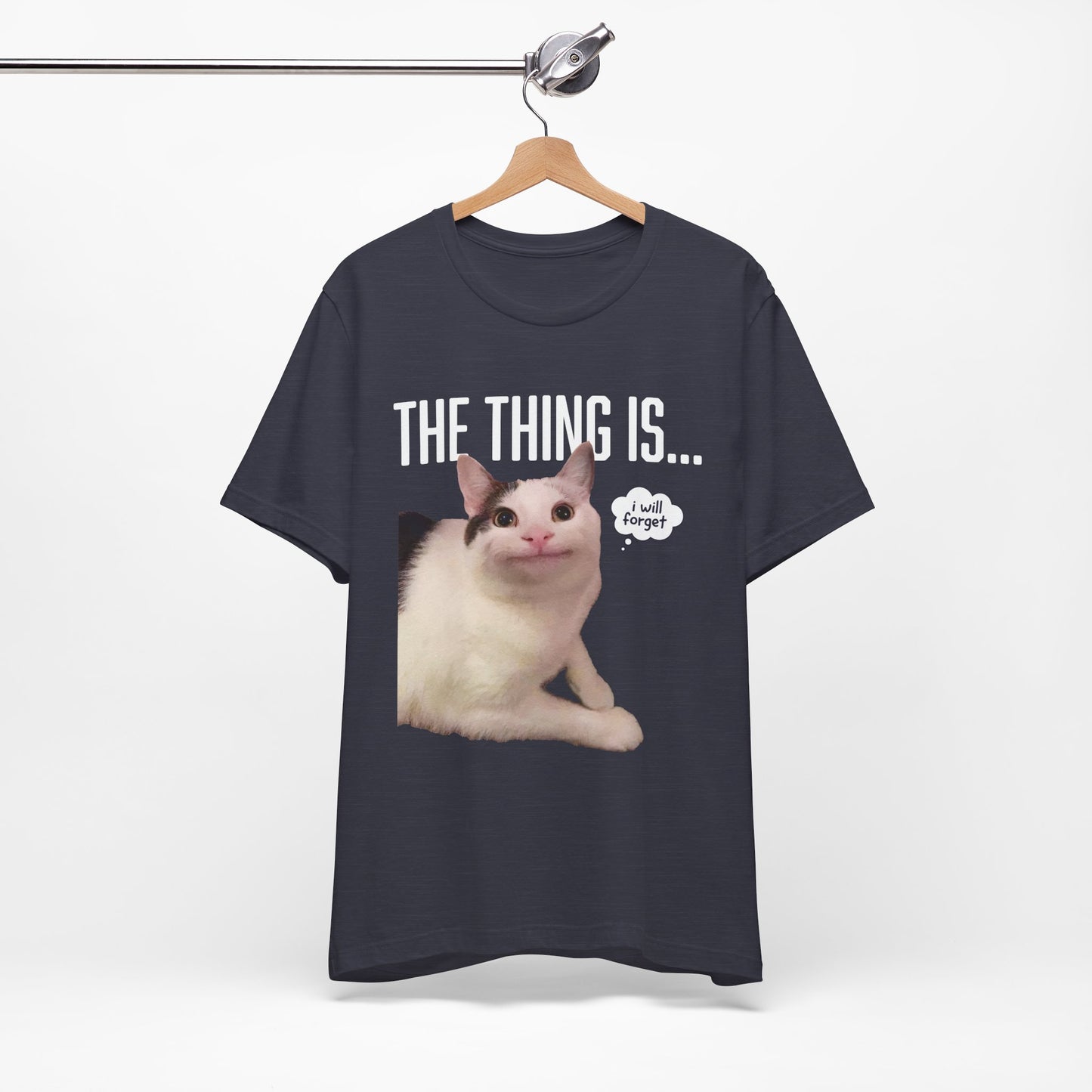 Black t-shirt with a cat graphic and text on a hanger against a white background