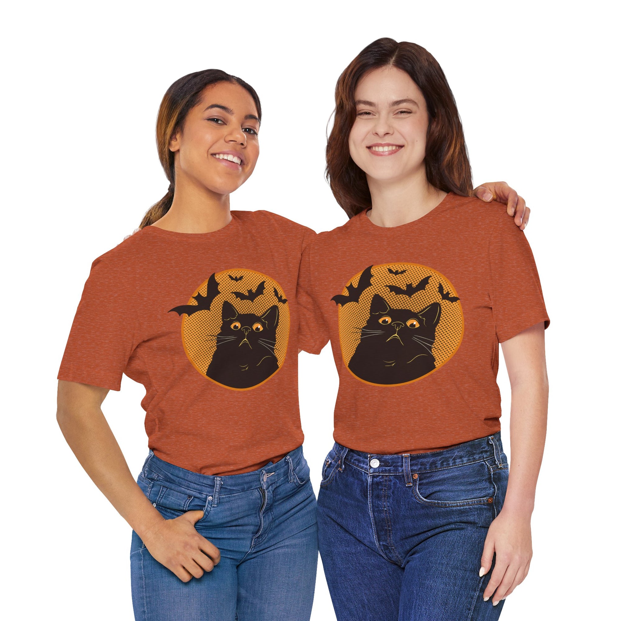 Two women wearing matching Halloween-themed t-shirts with a black cat and bats design.