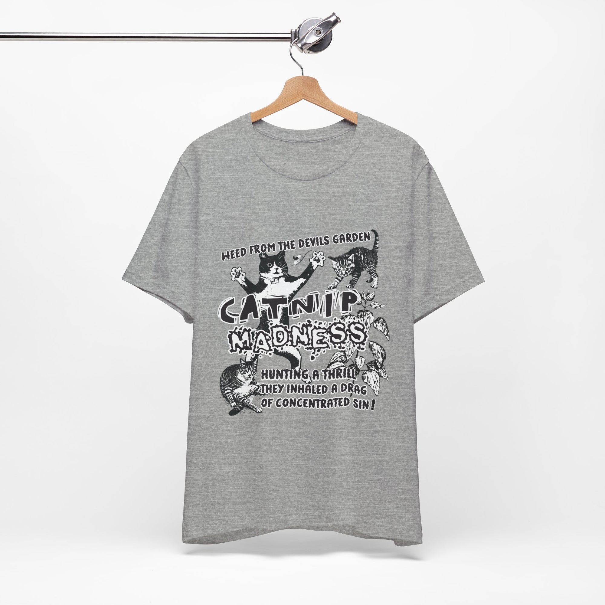 Gray t-shirt with graphic design and text on a hanger against a white background