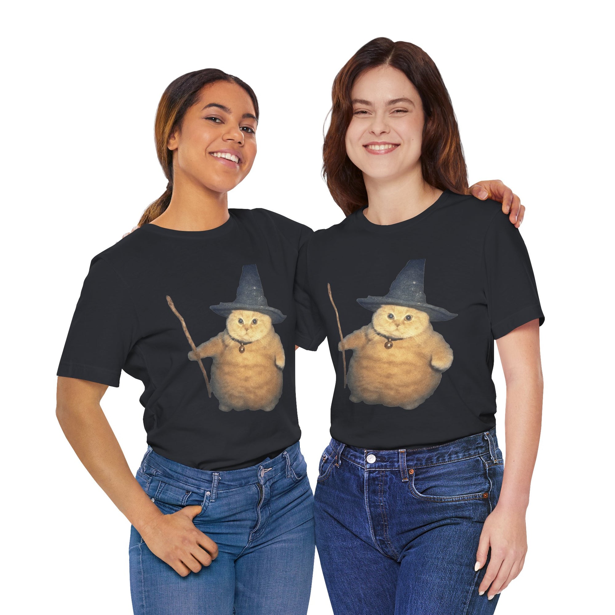 Two people wearing black t-shirts with a cartoon cat in a witch hat design on a white background.