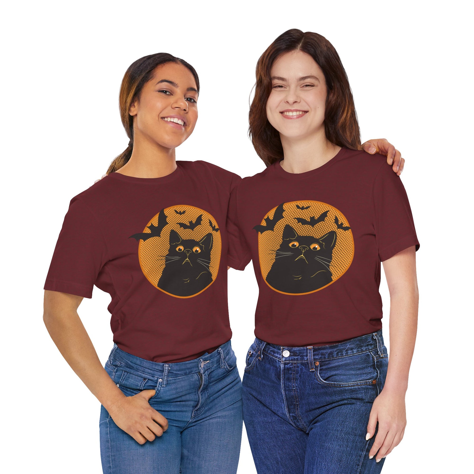 Two people wearing maroon t-shirts with a cat graphic and text on a white background