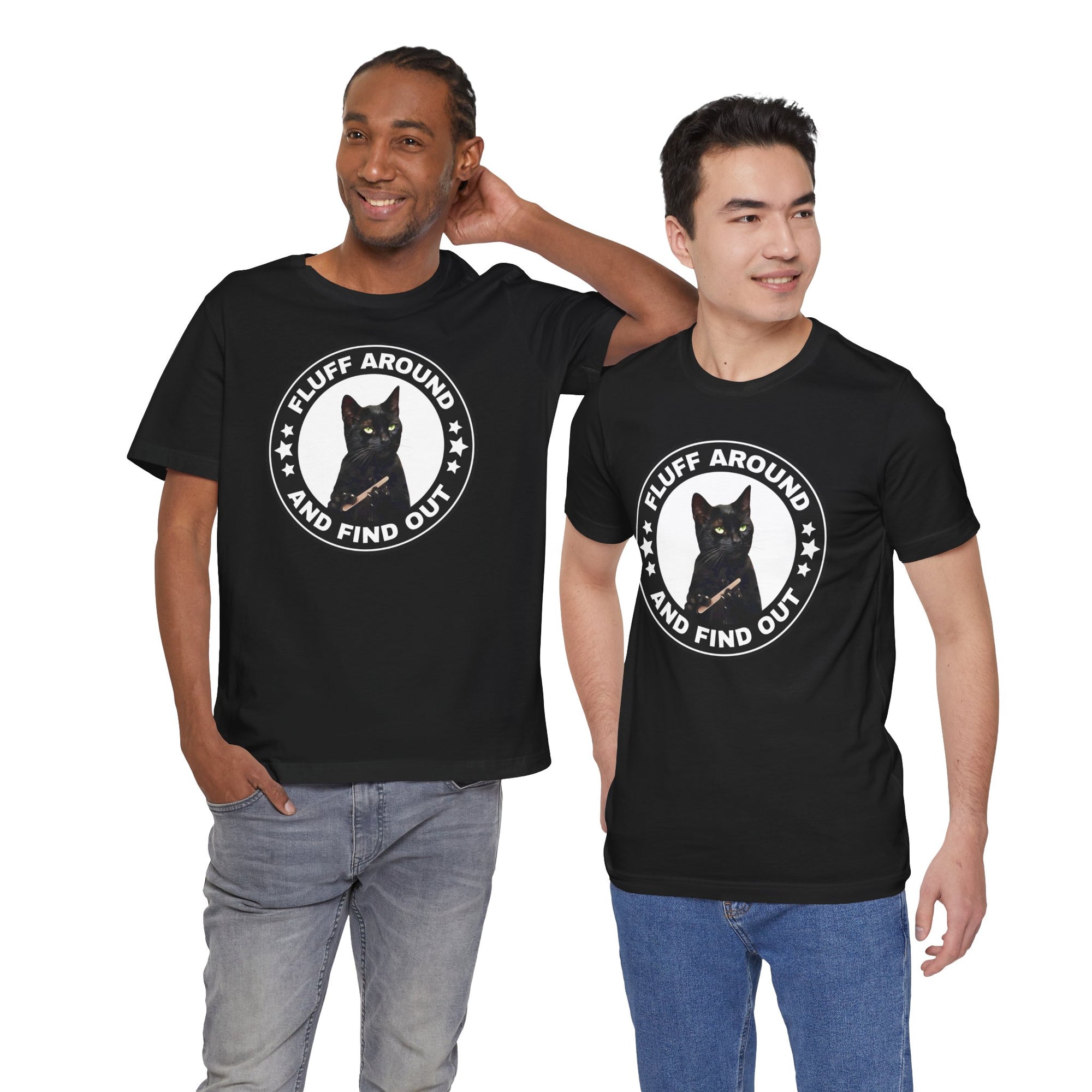 Two men wearing black t-shirt featuring a circular badge design with a black cat and the phrase “Fluff Around and Find Out.”