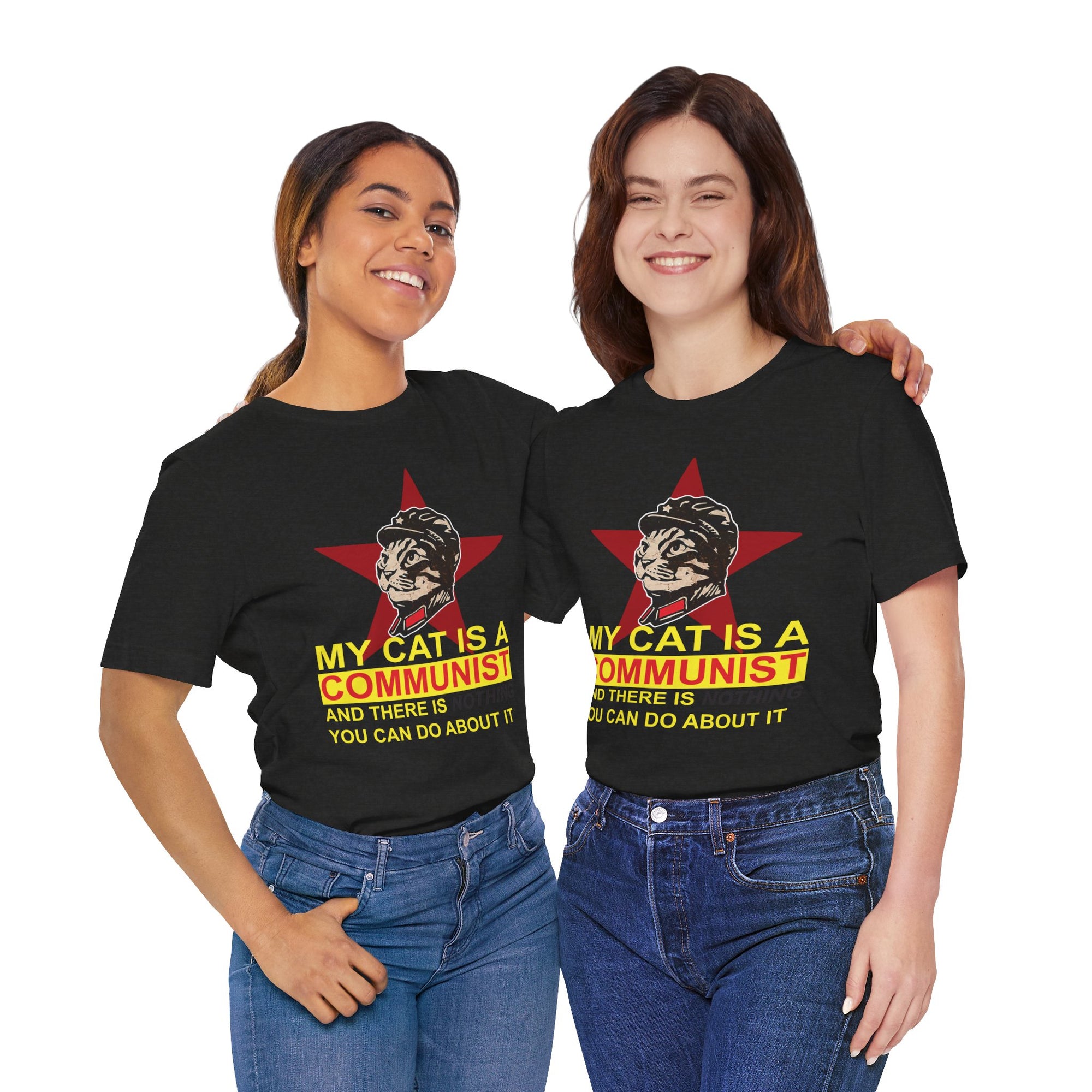 Black t-shirt featuring a bold “My Cat Is a Communist” graphic with a revolutionary cat portrait, yellow text, and a dark red star background.
