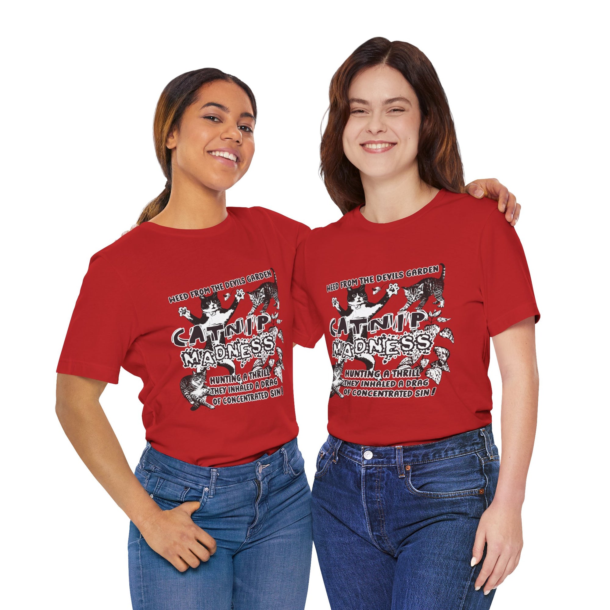 Two people wearing red t-shirts with a cat graphic and text.