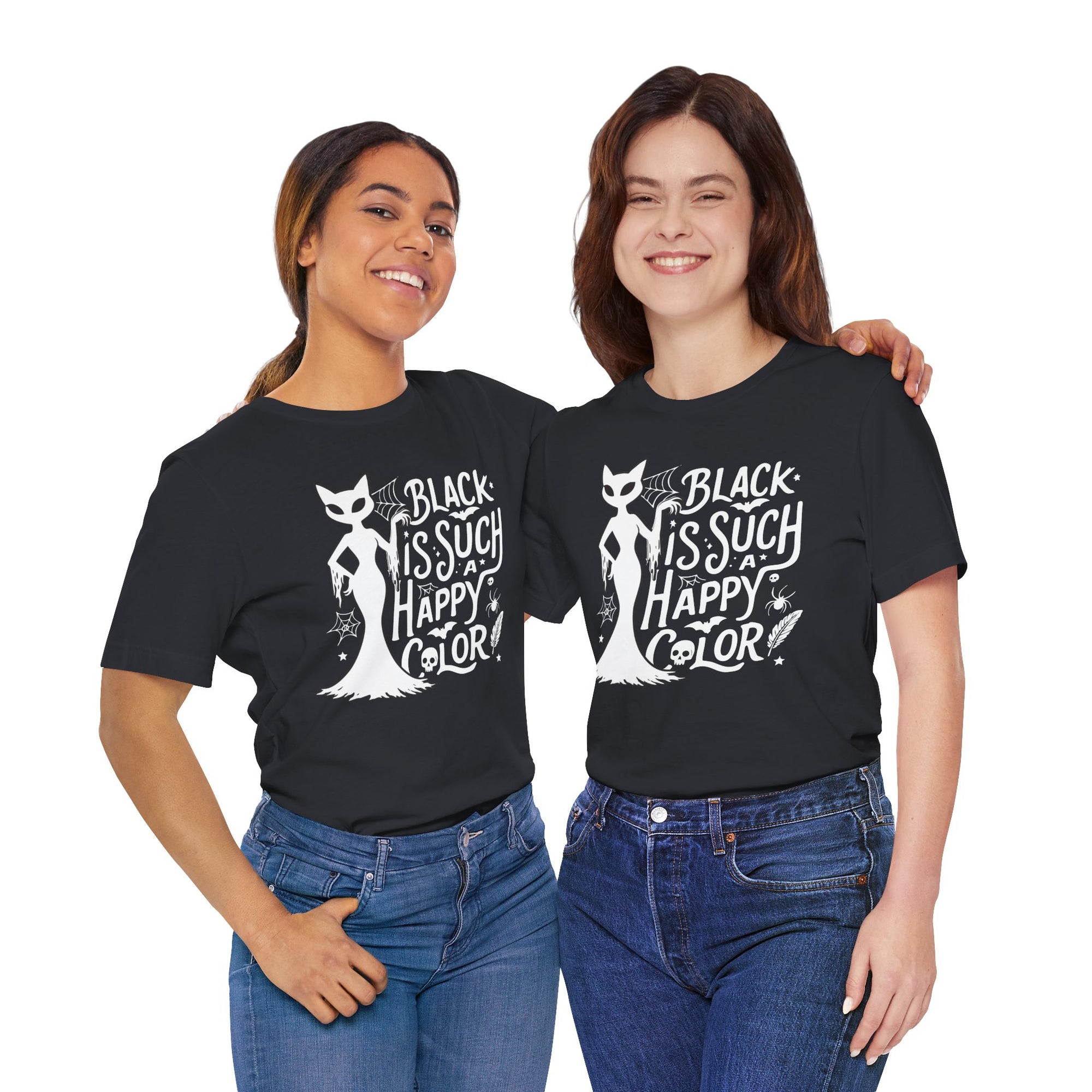 Two people wearing Black t-shirt featuring a white spooky cat graphic with the phrase “Black Is Such a Happy Color,” plus bats, spiderwebs, stars, and Halloween details.

