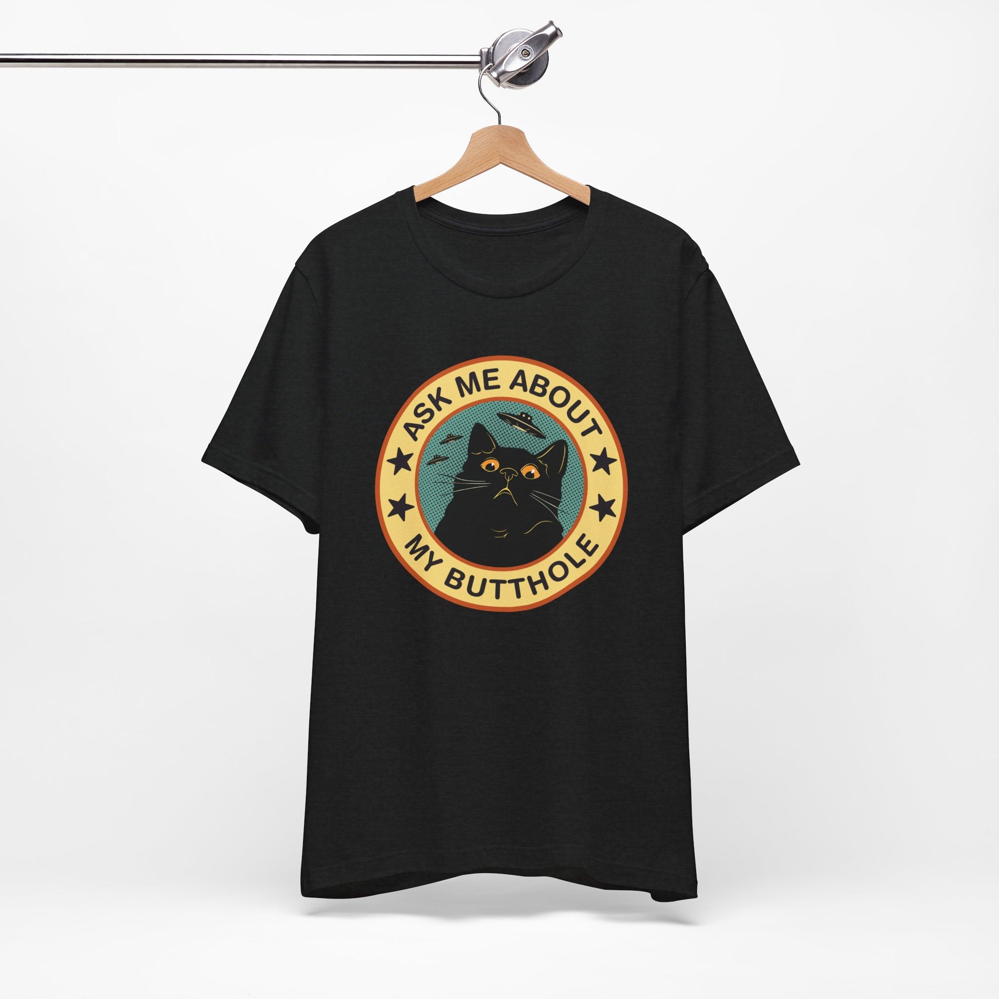 Black t-shirt with a graphic design featuring a cat and text on a white background