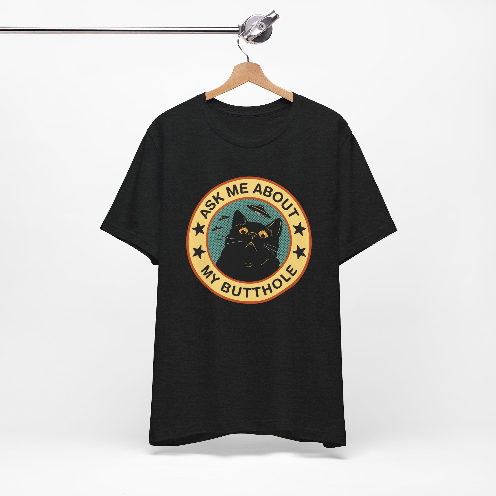 Black t-shirt with a graphic design featuring a cat and text on a white background