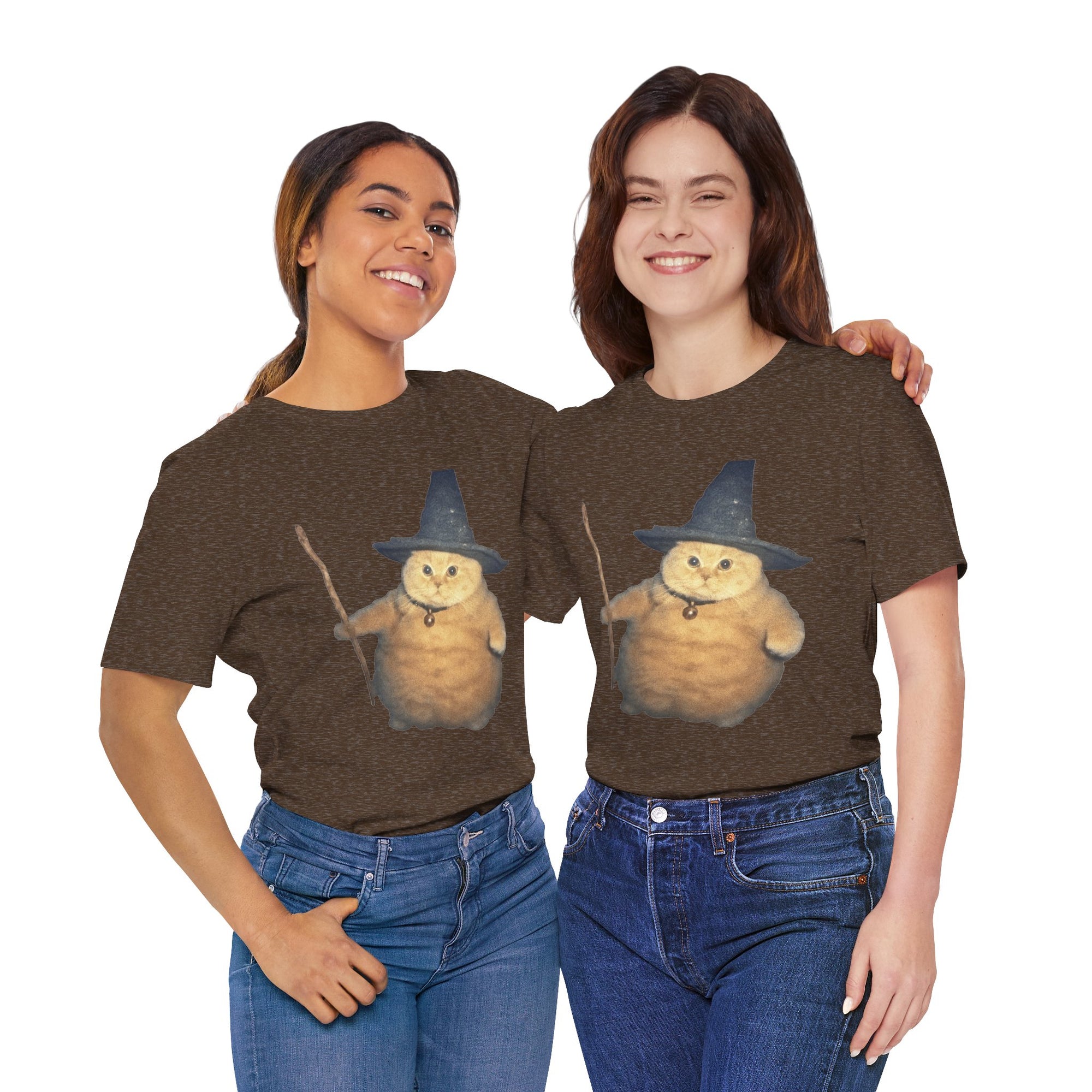 Two people wearing brown t-shirts with a cartoon cat in a witch hat design on a white background.