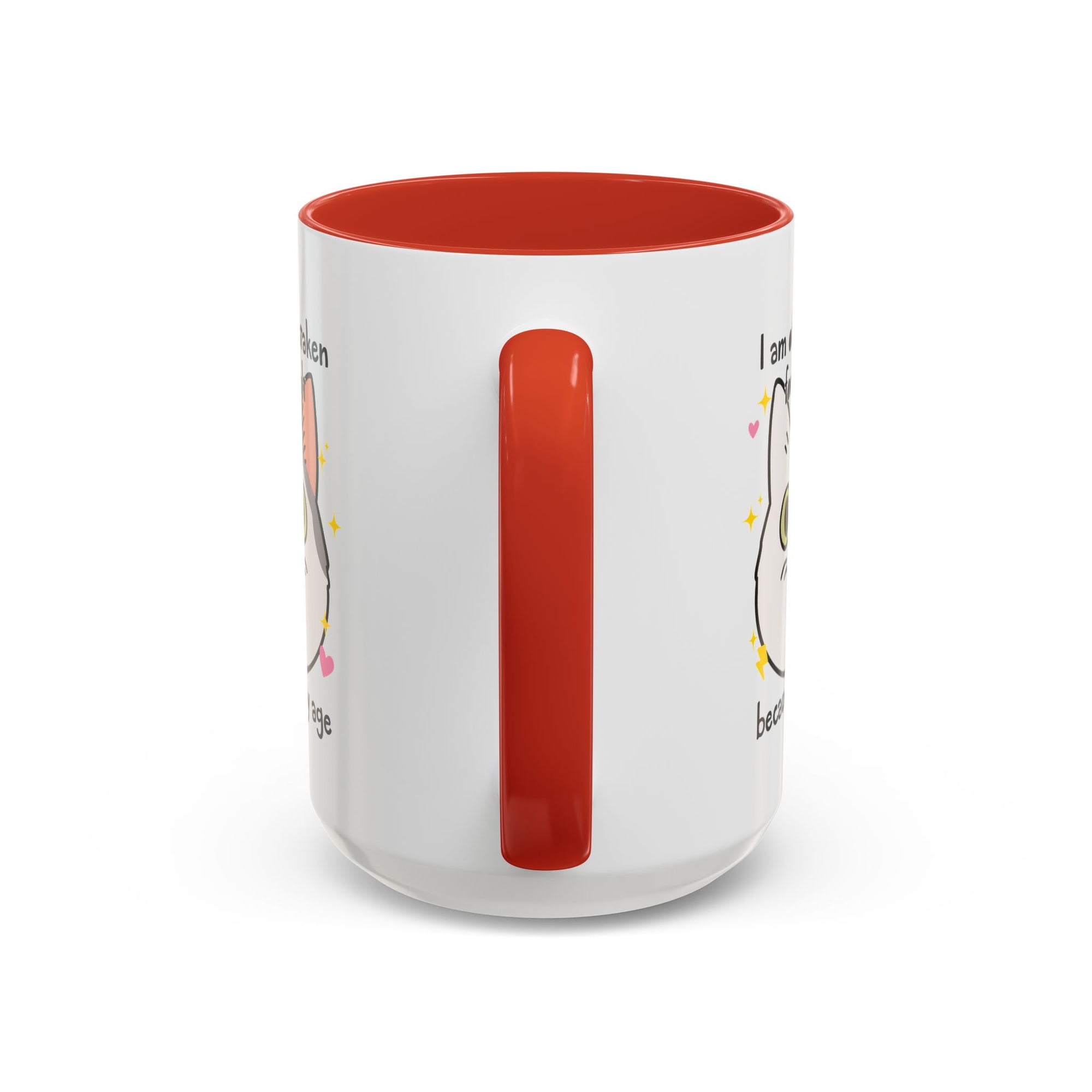 White ceramic mug with red handle and interior featuring a cute wide-eyed cat face, hearts, sparkles, and the phrase “I am often mistaken for an adult because of my age.”
