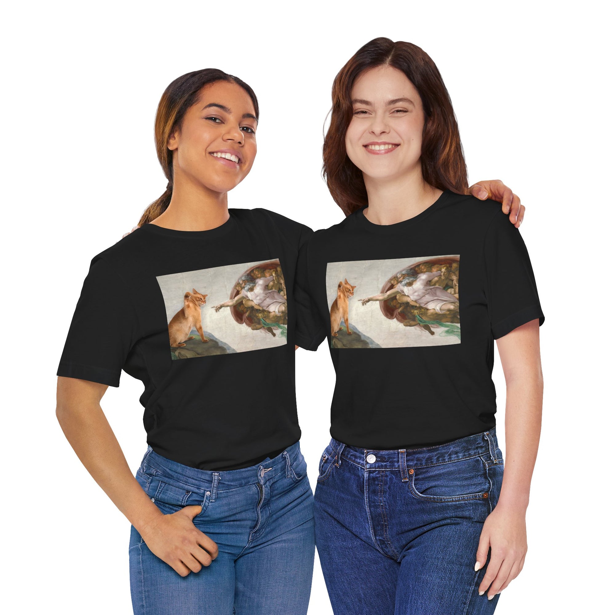 Two people wearing black t-shirts with a graphic design of a cat and god on a white background.