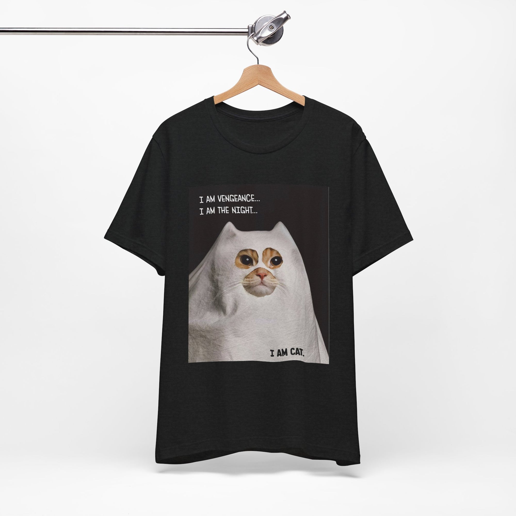Black t-shirt with a cat graphic and text on a hanger against a white background