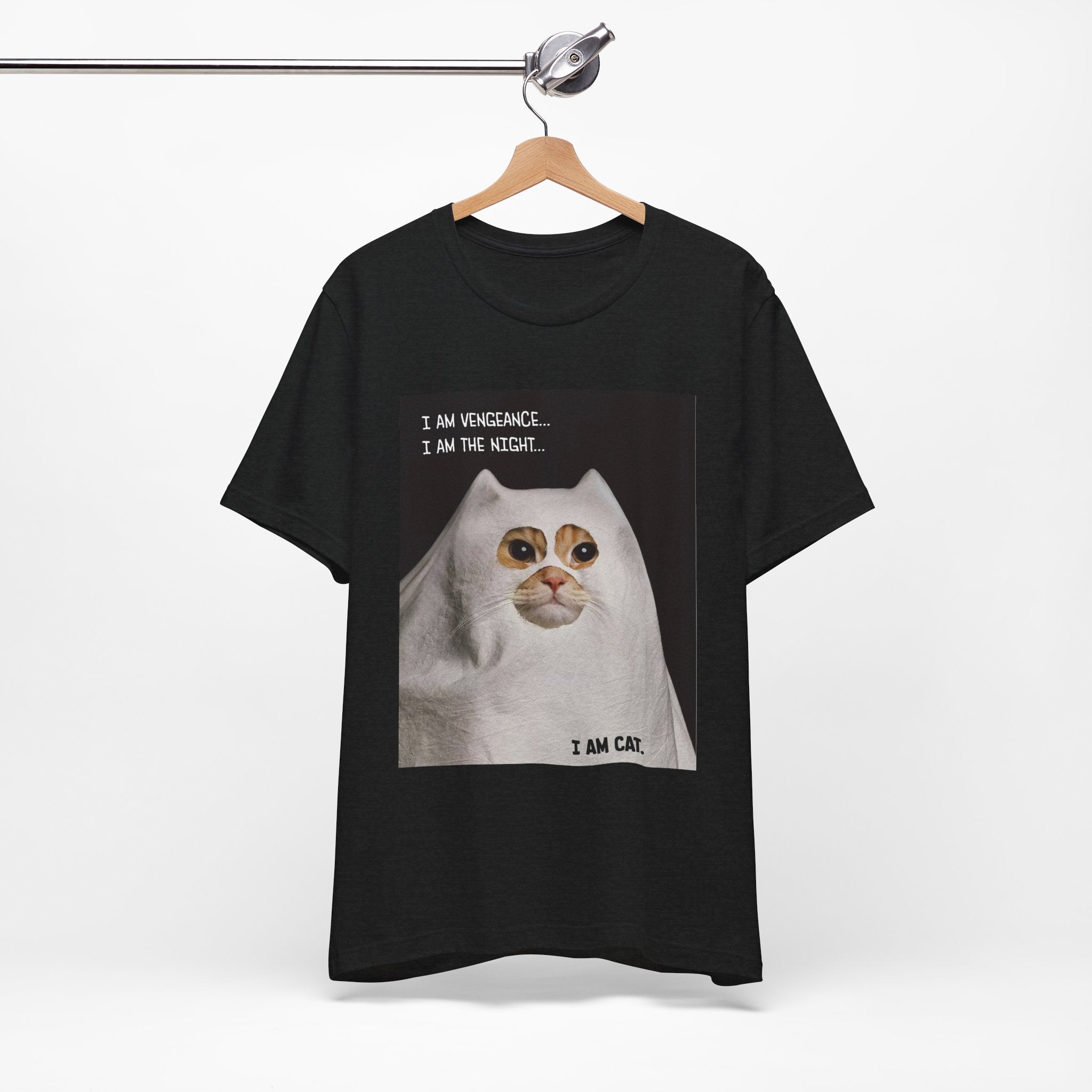 Black t-shirt with a cat graphic and text on a hanger against a white background