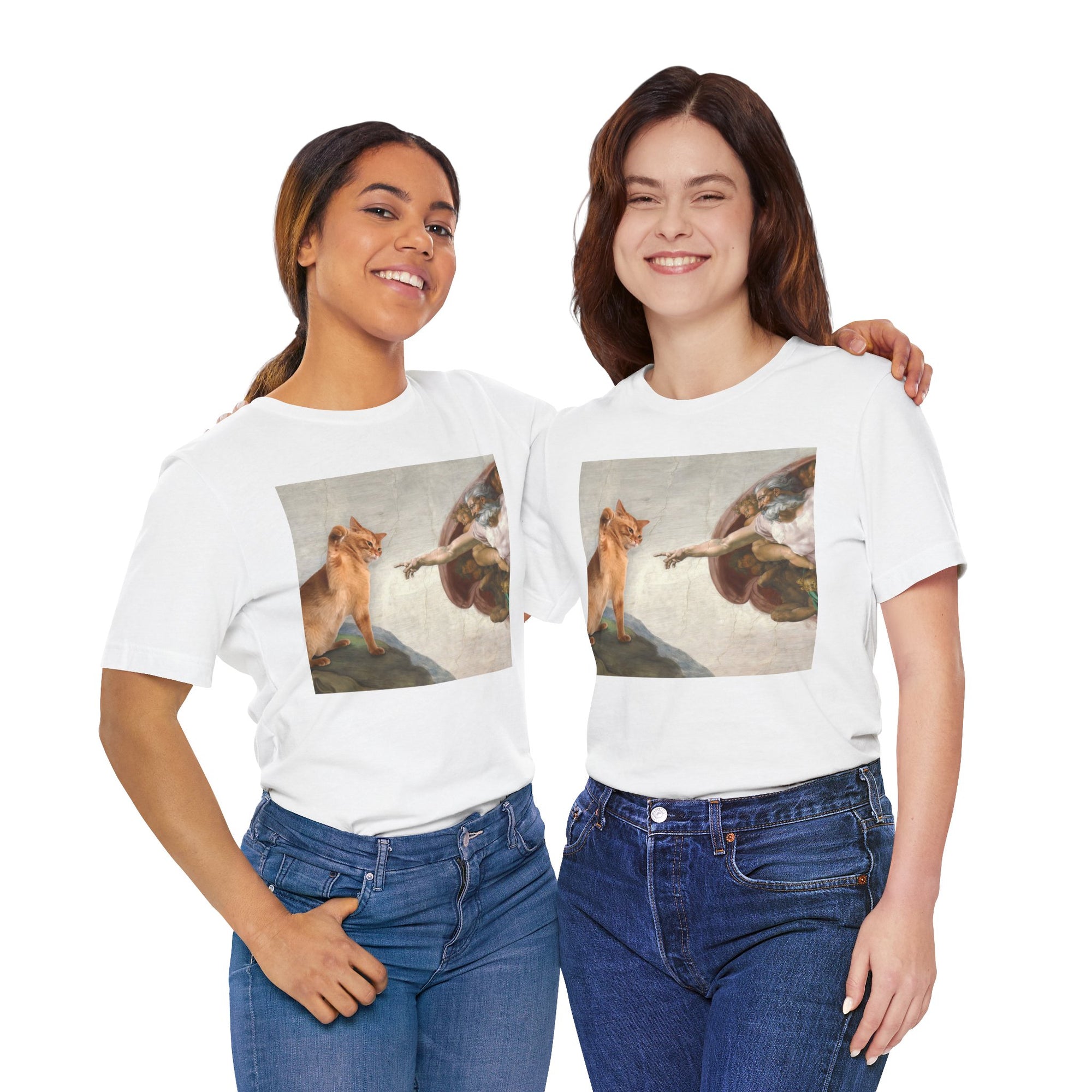 Two women wearing white t-shirts with artistic prints, standing side by side against a white background.