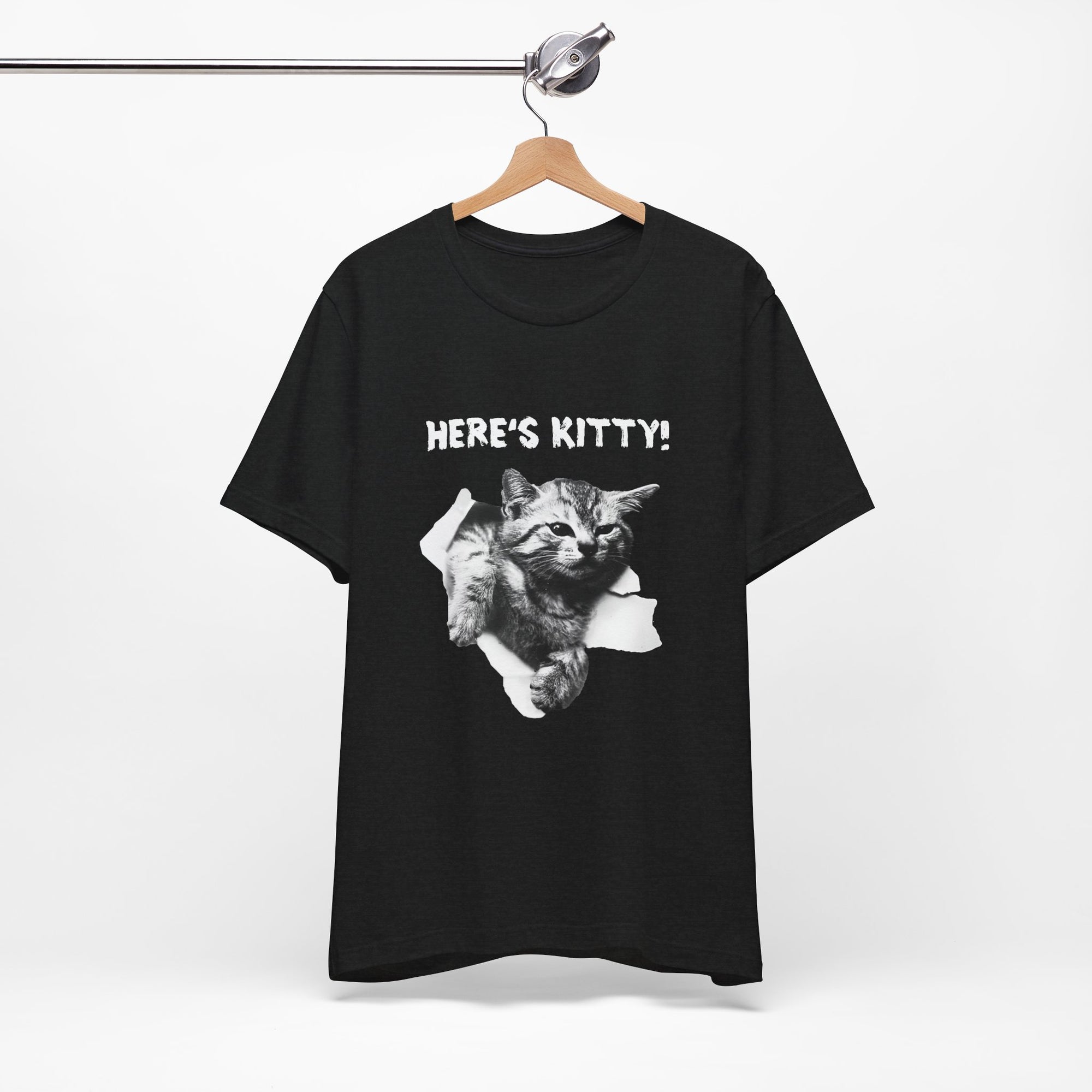 Black t-shirt with a cat graphic and 'HERE'S KITTY!' text on a hanger against a white background