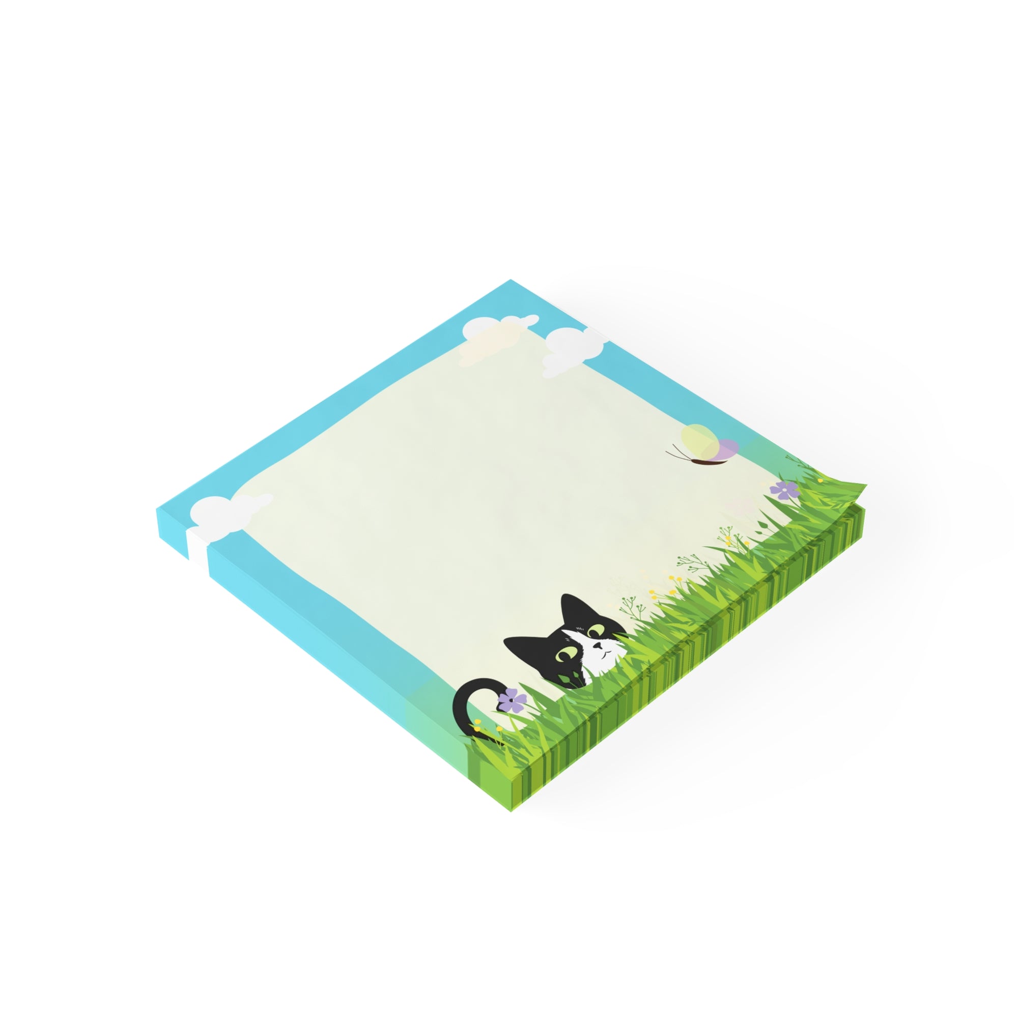 Stack of sticky notes with a black and white cat peeking from tall grass, flowers, clouds, and a light blank writing area in the center.
