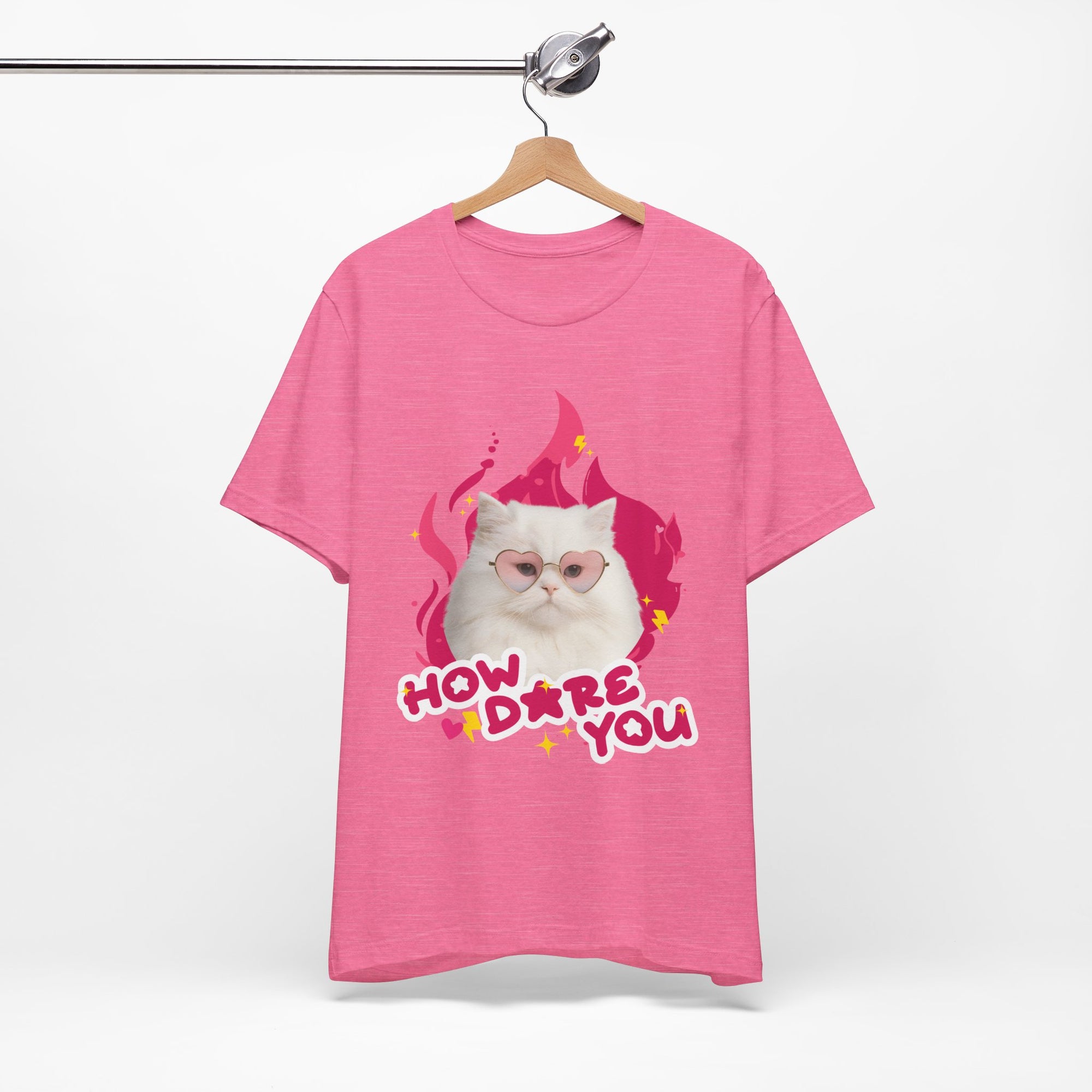Pink t-shirt with a cat graphic and text on a white background