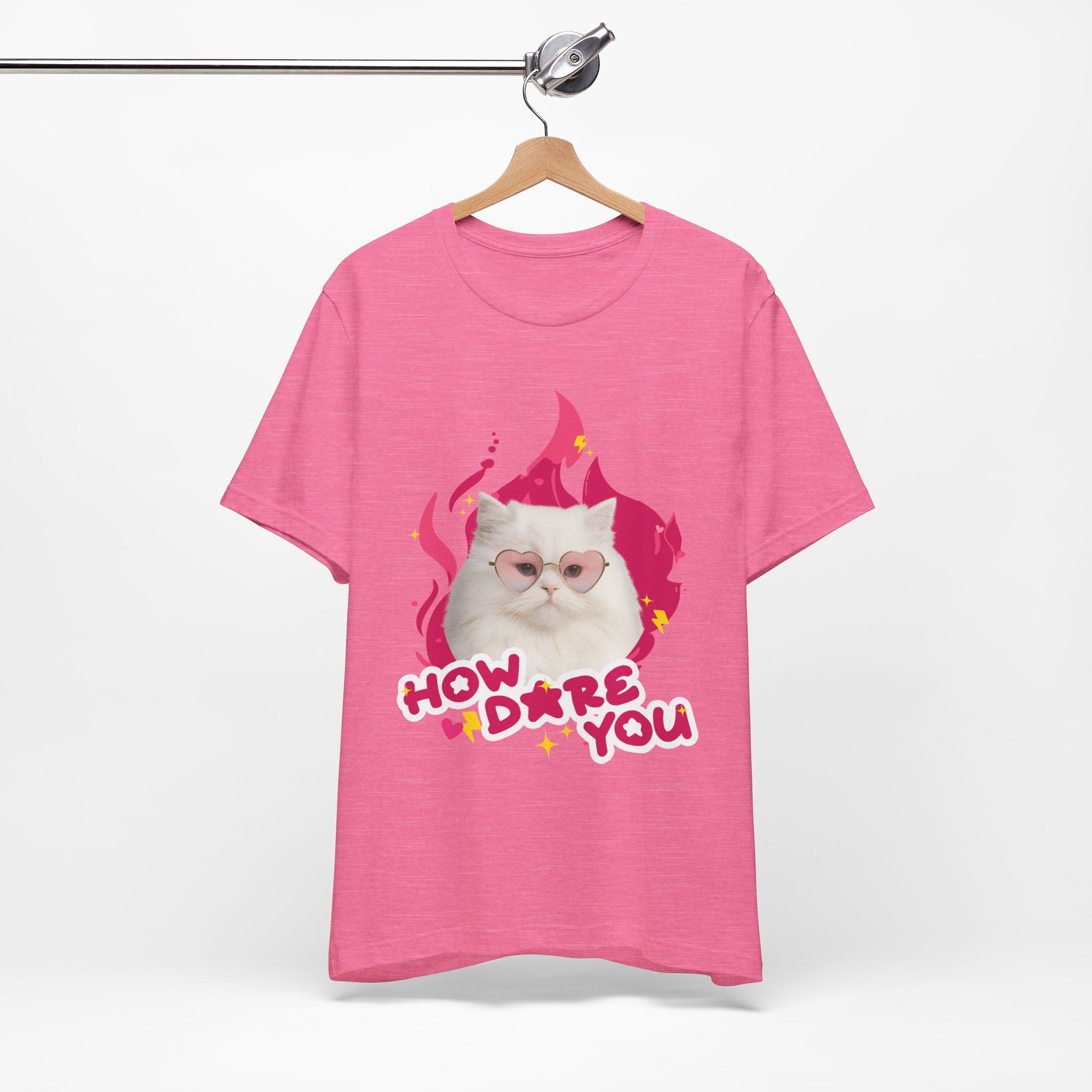 Pink t-shirt with a cat graphic and text on a white background