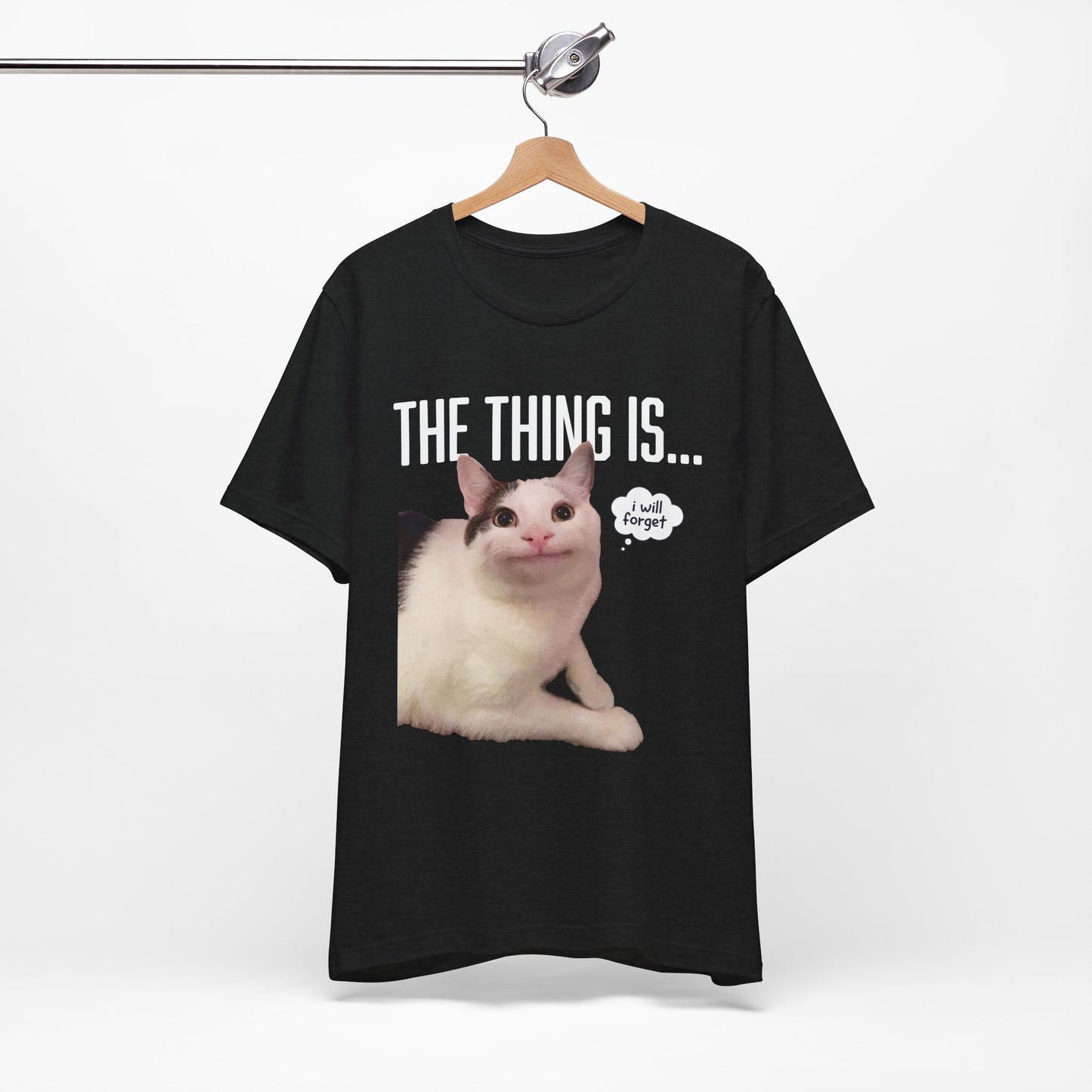 Black t-shirt with a cat graphic and text on a hanger against a white background