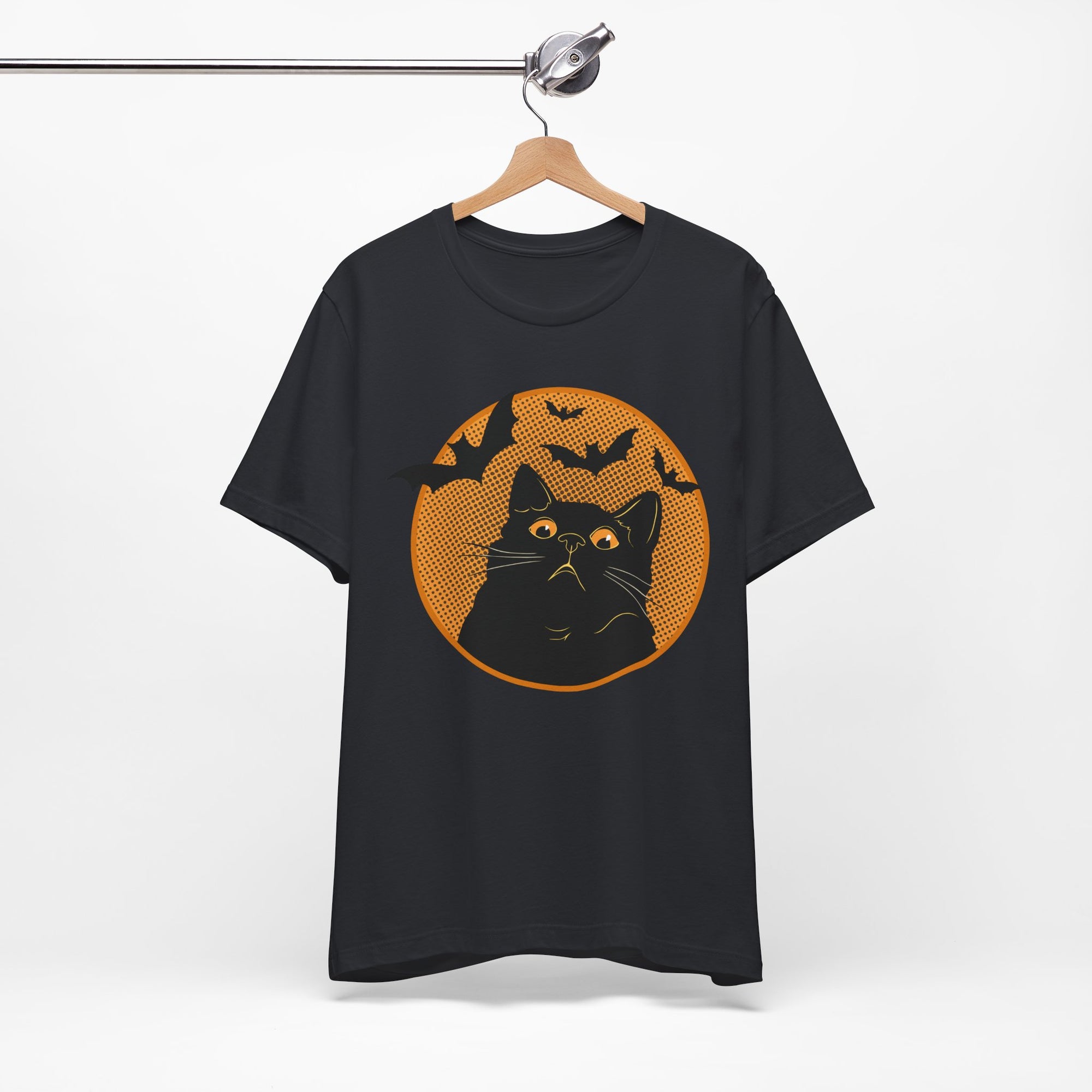 Black t-shirt featuring a retro-style black cat graphic with orange moon, flying bats, and Halloween-inspired details.
